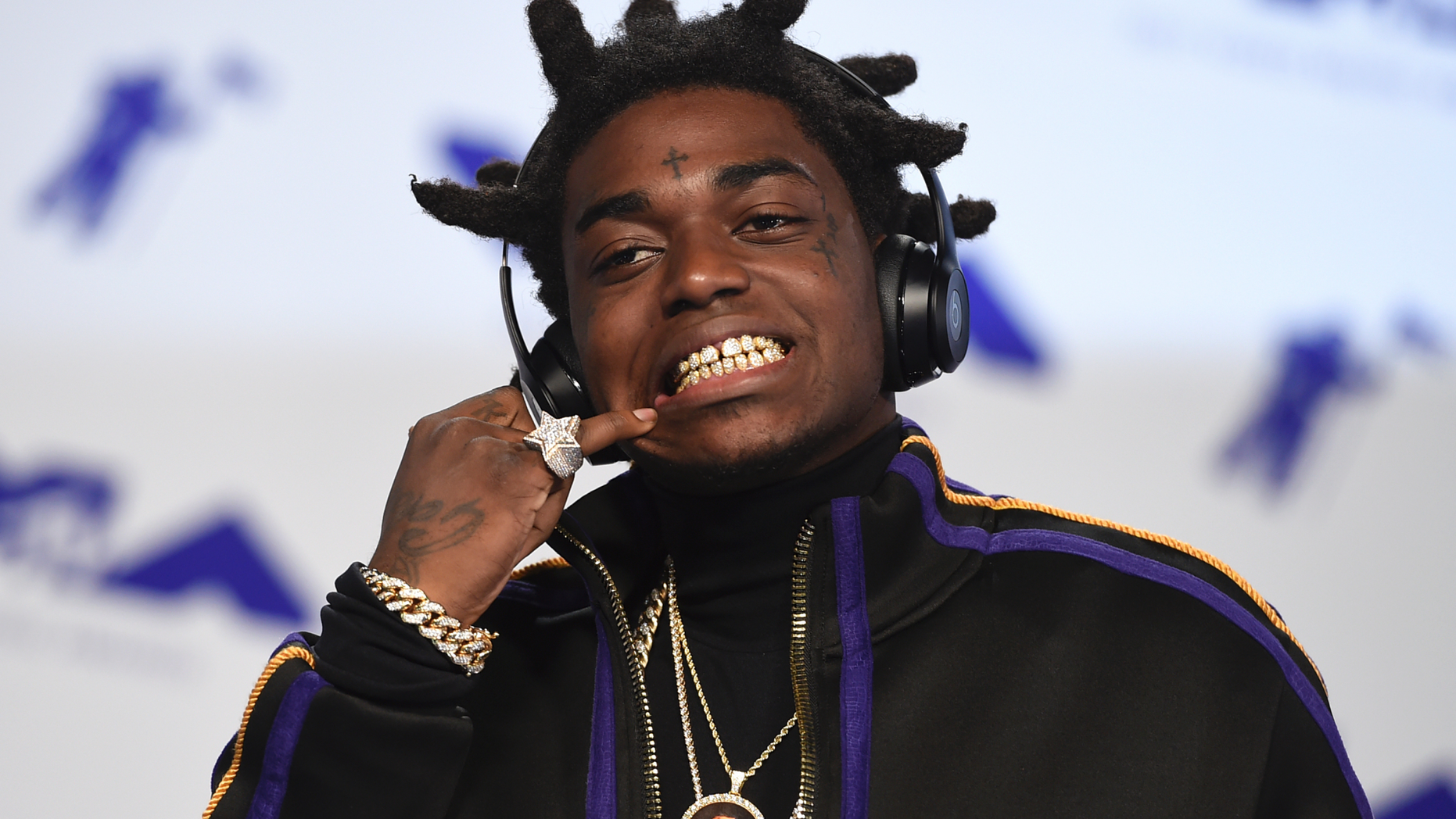 Kodak Black arrives at the MTV Video Music Awards at The Forum in Inglewood, Calif. Officials say Florida rapper Kodak Black was arrested on federal and state weapons charges just before he was to perform at a hip-hop festival. The U.S. Marshals office says in a news release that the 21-year-old Black was taken into custody Saturday, May 11, 2019 at the Rolling Loud Music Festival at Hard Rock Stadium in Miami Gardens. The statement didn’t elaborate.