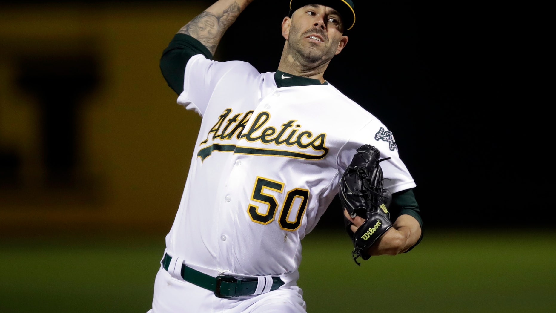 Oakland Athletics pitcher Mike Fiers works against the Cincinnati Reds during the first inning of a baseball game Tuesday, May 7, 2019, in Oakland, Calif. (Associated Press)