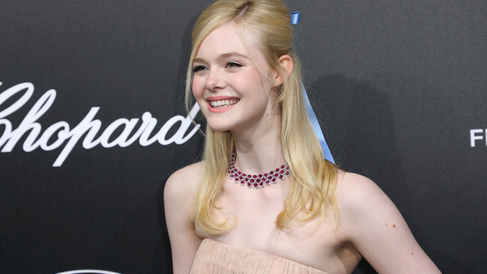 Actress Elle Fanning poses for photographers upon arrival at the Chopard Trophee event at the 72nd international film festival, Cannes, southern France, Monday, May 20, 2019.