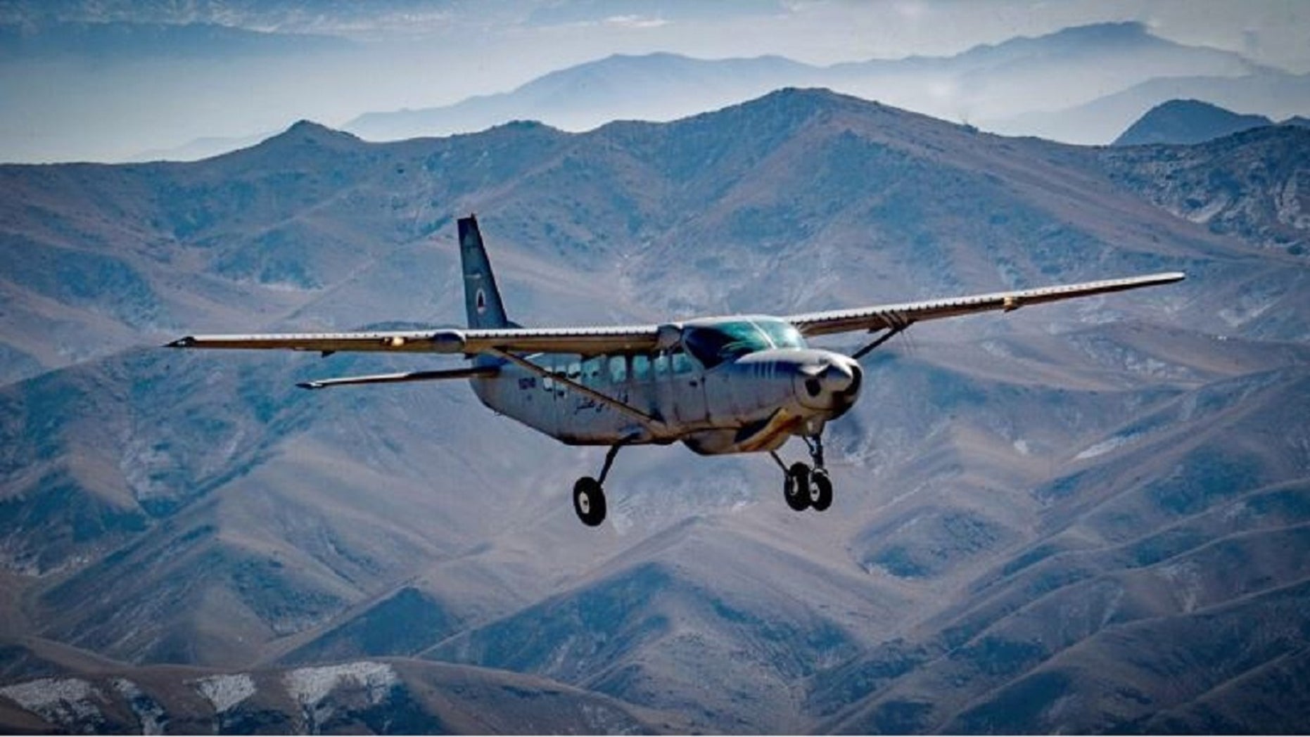 An Afghan pilot conducts training in a C-208 Caravan over Kabul, Afghanistan as part of the Train Advise and Assist Command's mission on Dec. 18, 2018.