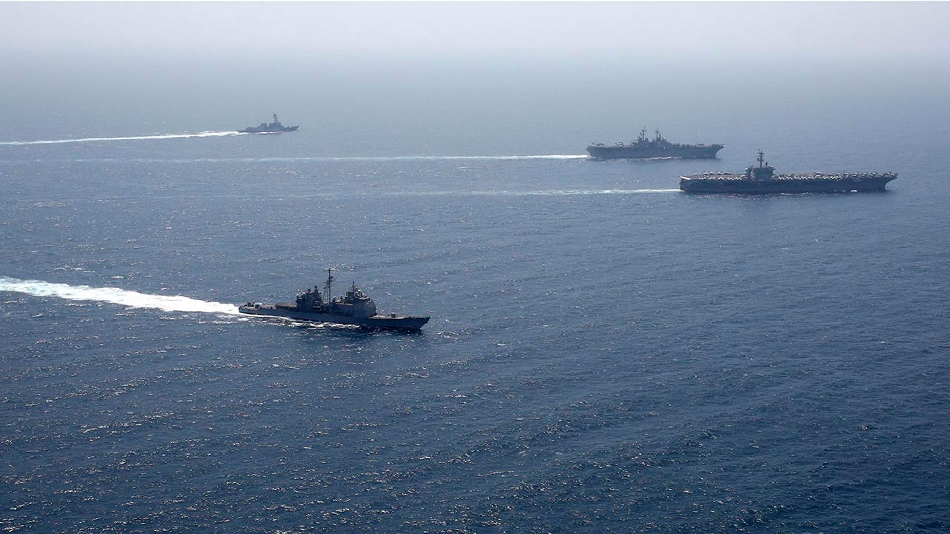In this photo released by the U.S. Navy, the Abraham Lincoln Carrier Strike Group and Kearsarge Amphibious Ready Group conduct joint operations in the U.S. 5th Fleet area of operations - file photo.