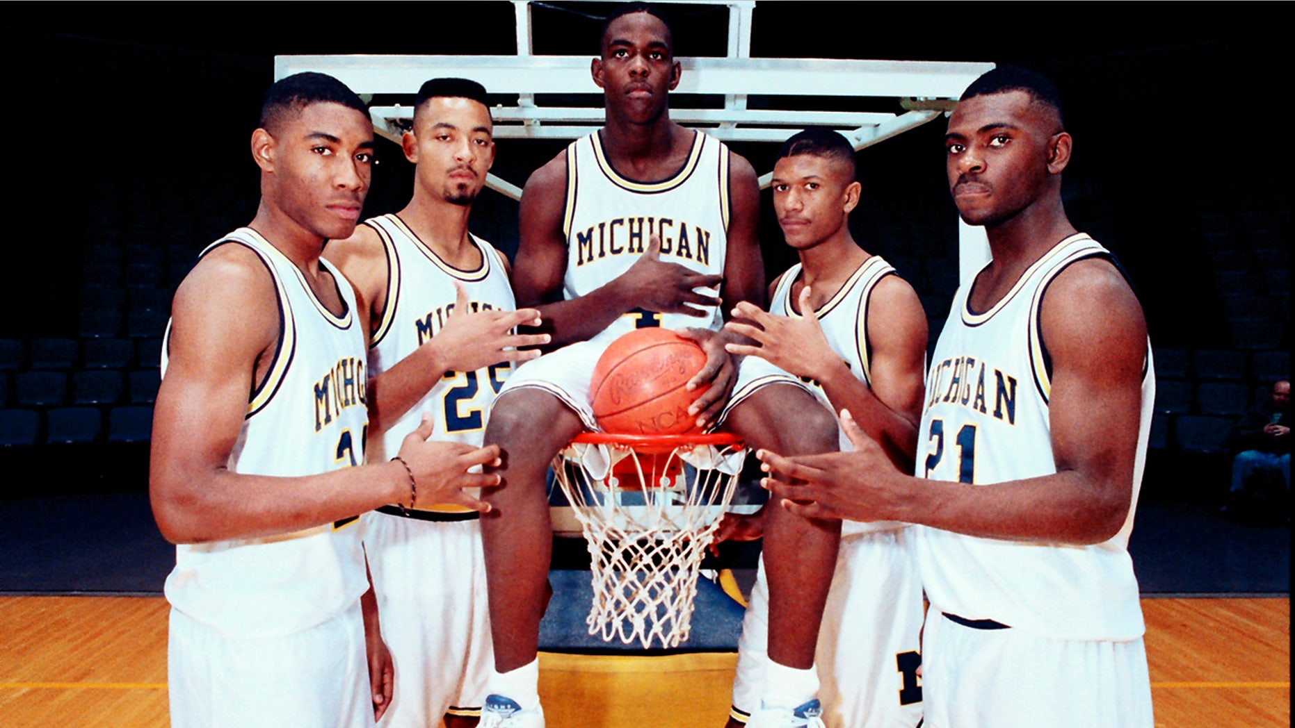 FILE - In this November 1991 file photo, Michigan's Fab Five, from left, Jimmy King, Juwan Howard, Chris Webber, Jalen Rose and Ray Jackson pose in Ann Arbor, Mich. Howard is coming back to Michigan. The former member of the Fab Five agreed to a five-year deal, which will pay him $2 million in his first year, on Wednesday, May 22, 2019, to lead the Wolverines. (AP Photo, File)