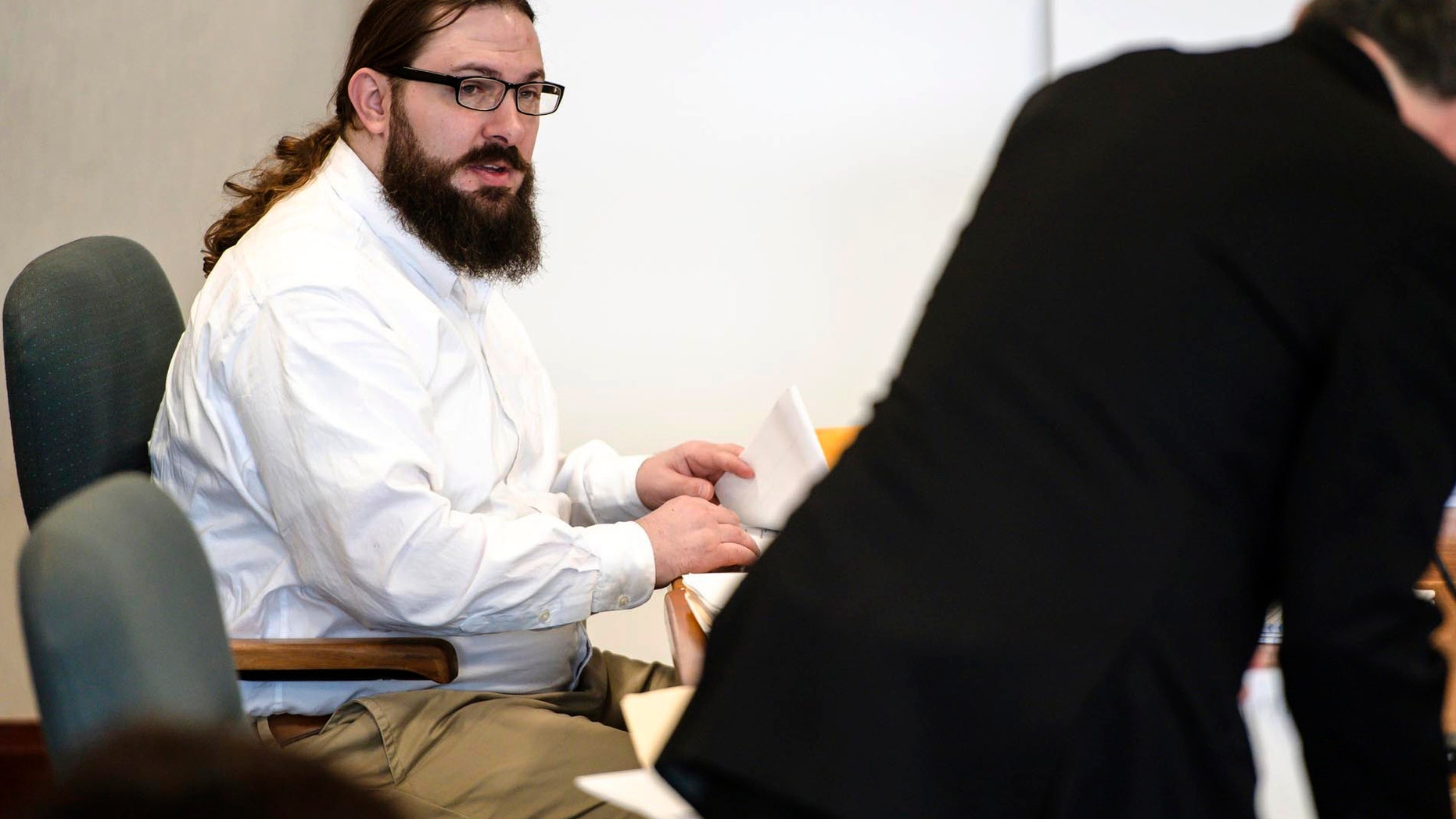 FILE - In this May 15, 2019 file photo, Steven Bourgoin, left, greets his defense attorney Robert Katims during his murder trial in Vermont Superior Court in Burlington, Vt. Closing arguments are expected Monday, May 20 in the trial of Bourgoin, a Vermont man facing murder charges in the deaths of five teenagers after he drove the wrong way on Interstate 89. (Glenn Russell/VTDigger.org via AP, Pool, File)