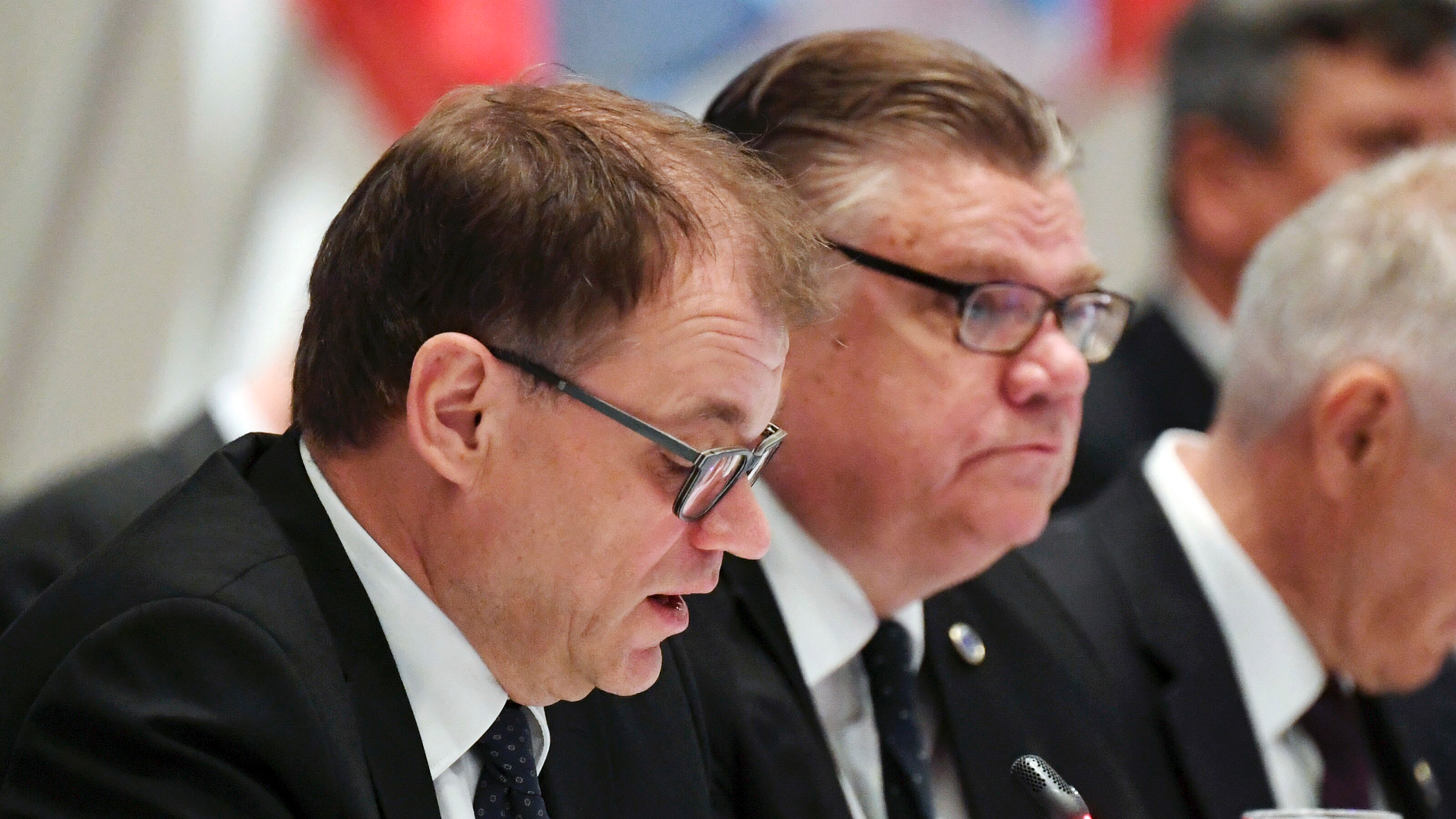 Finnish Prime Minister Juha Sipil', left, and Foreign Minister Timo Soini attend during a Ministers for Foreign Affairs of a Council of Europe's annual public in Helsinki, Finland Friday, May 17, 2019. (Vesa Moilanen/Lehtikuva around AP)