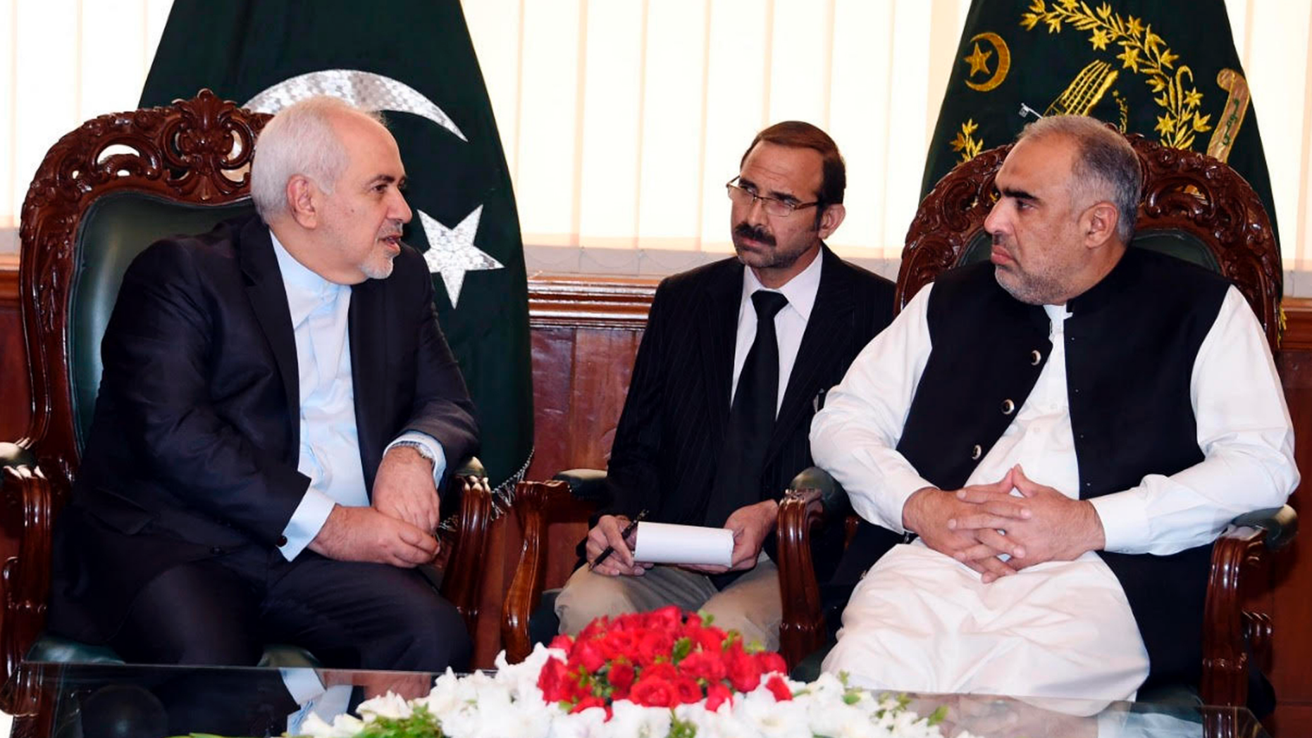 In this photo released by the National Assembly, Iranian Foreign Minister Mohammad Javad Zarif, left, meets Speaker National Assembly Asad Qaiser in Islamabad, Pakistan, Friday, May 24, 2019. Zarif is in Pakistan Friday on a critically timed visit amid a crisis between Tehran and Washington and ahead of next week's emergency Arab League meeting called by Saudi Arabia as regional tensions escalate. (Pakistan National Assembly via AP)