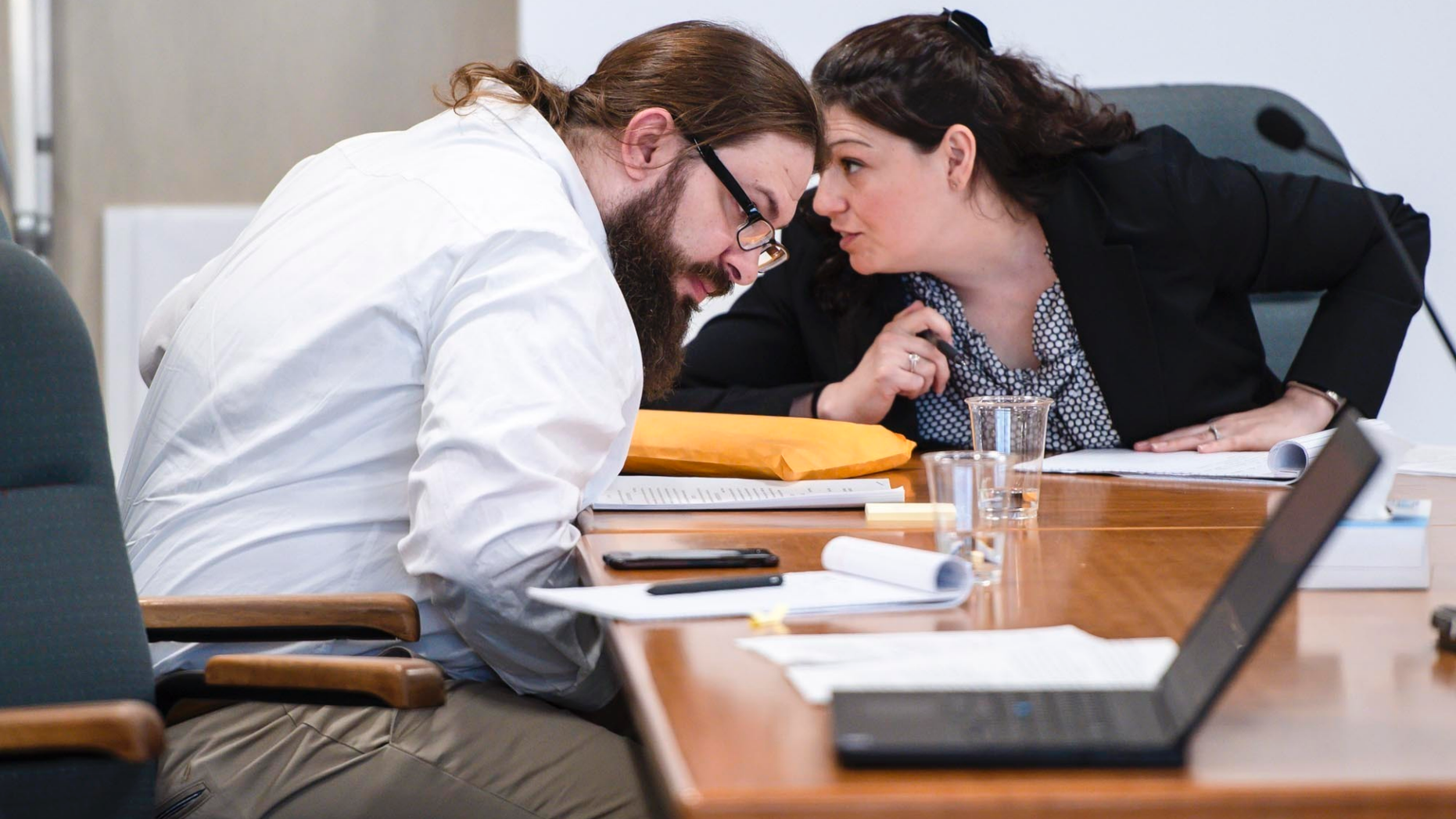 Steven Bourgoin confers with a member of his defense team during his murder trial in Vermont Superior Court in Burlington, Vt. on Tuesday, May 21, 2019. A jury has begun deliberations in the trial of the Vermont man facing murder charges in the deaths of five teenagers after he caused a head-on crash by driving the wrong way on an interstate. (Glenn Russell/VTDigger.org via AP, Pool, File)