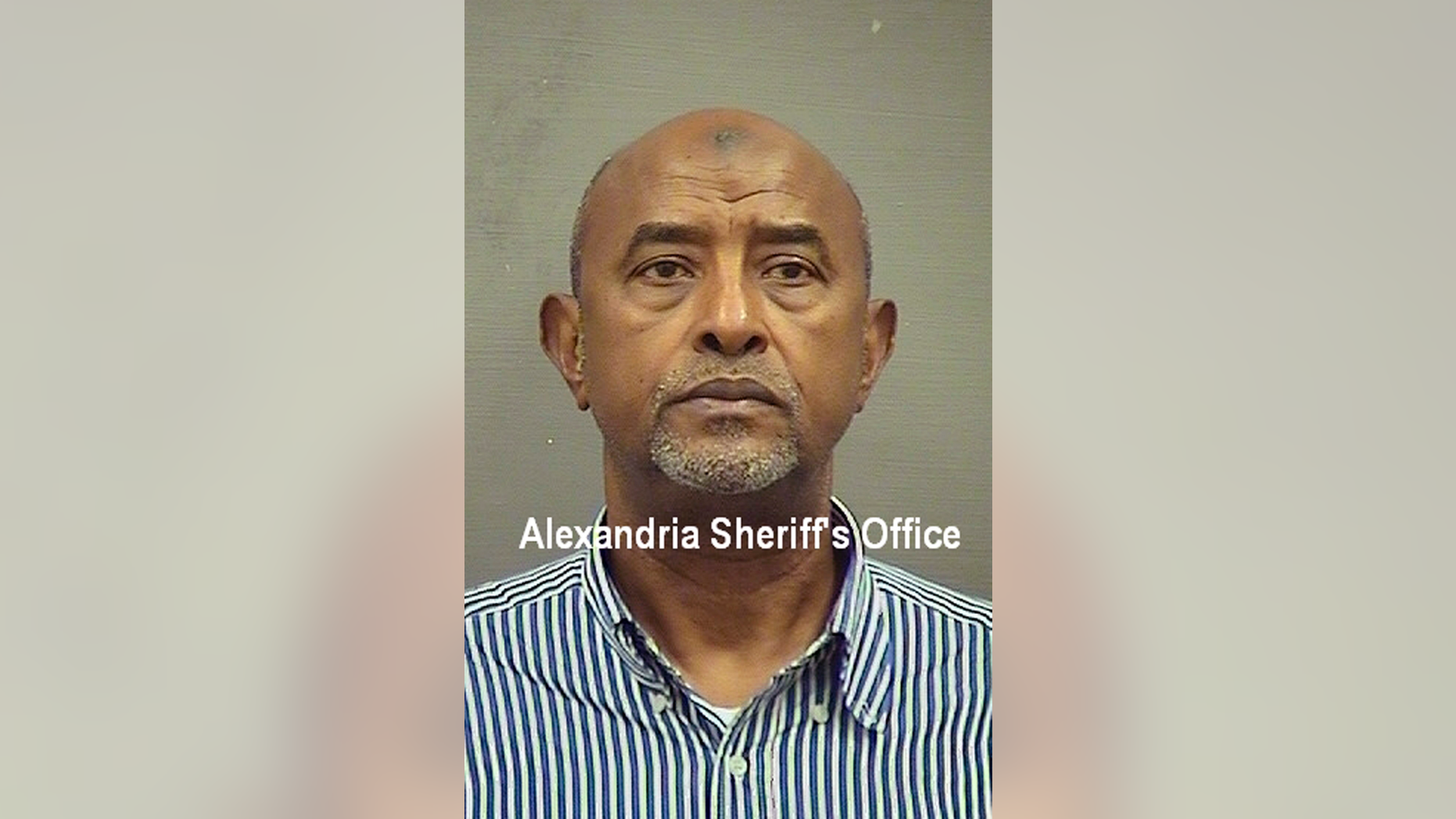 This Saturday, May 4, 2019 booking photo provided by the Alexandria (Va.) Sheriff’s Office shows Abdirizak Jaji Raghe Wehelie, of Burke, Va. The former FBI translator has been charged with doctoring transcripts in which his own name appeared on intercepts of phone calls placed by a terrorism suspect. Wehelie was arrested Saturday and made an initial appearance Monday, May 6 at the federal courthouse in Alexandria, where is charged with making false statements and obstructing an investigation. (Alexandria (Va.) Sheriff’s Office via AP)