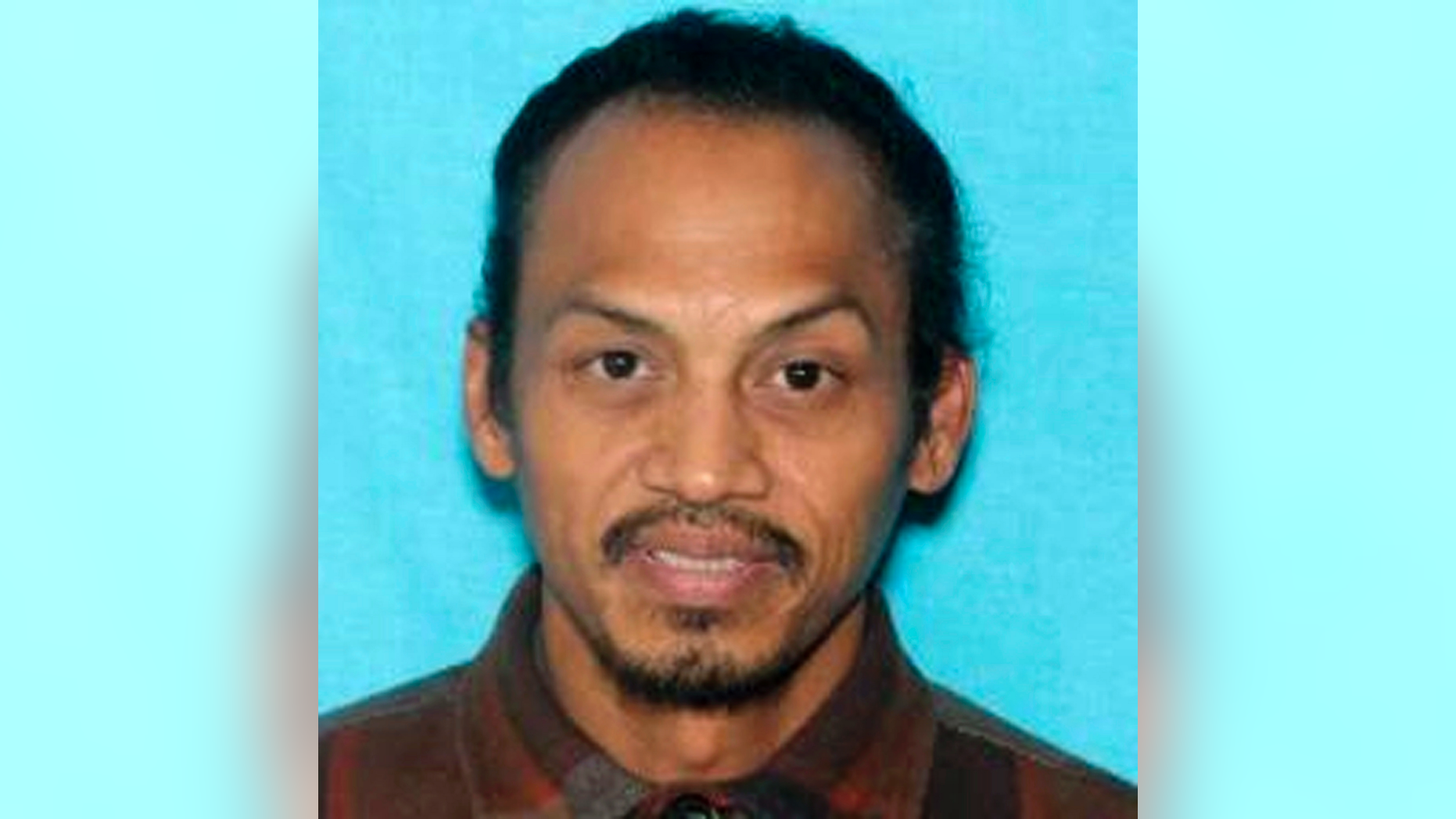 This undated booking photo provided by the Idaho State Police shows Jonathan Llana. A search was underway Thursday, May 23, 2019, in southern Idaho for Llana, suspected of shooting and killing a motorist on a Utah highway, Idaho State Police said in a statement. (Idaho State Police via AP)