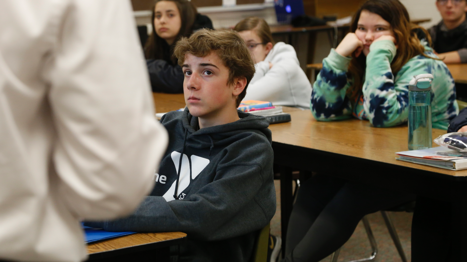 High school freshmen listen to Wexford County prosecutor Jason Elmore talk about consent and criminal sexual conduct on Wednesday, April 17, 2019, in Cadillac, Mich. Among other things, he reminded them that the legal age of consent for sexual contact in the state of Michigan is 16. Most of the students in these classes are younger than that. (AP Photo/Martha Irvine)