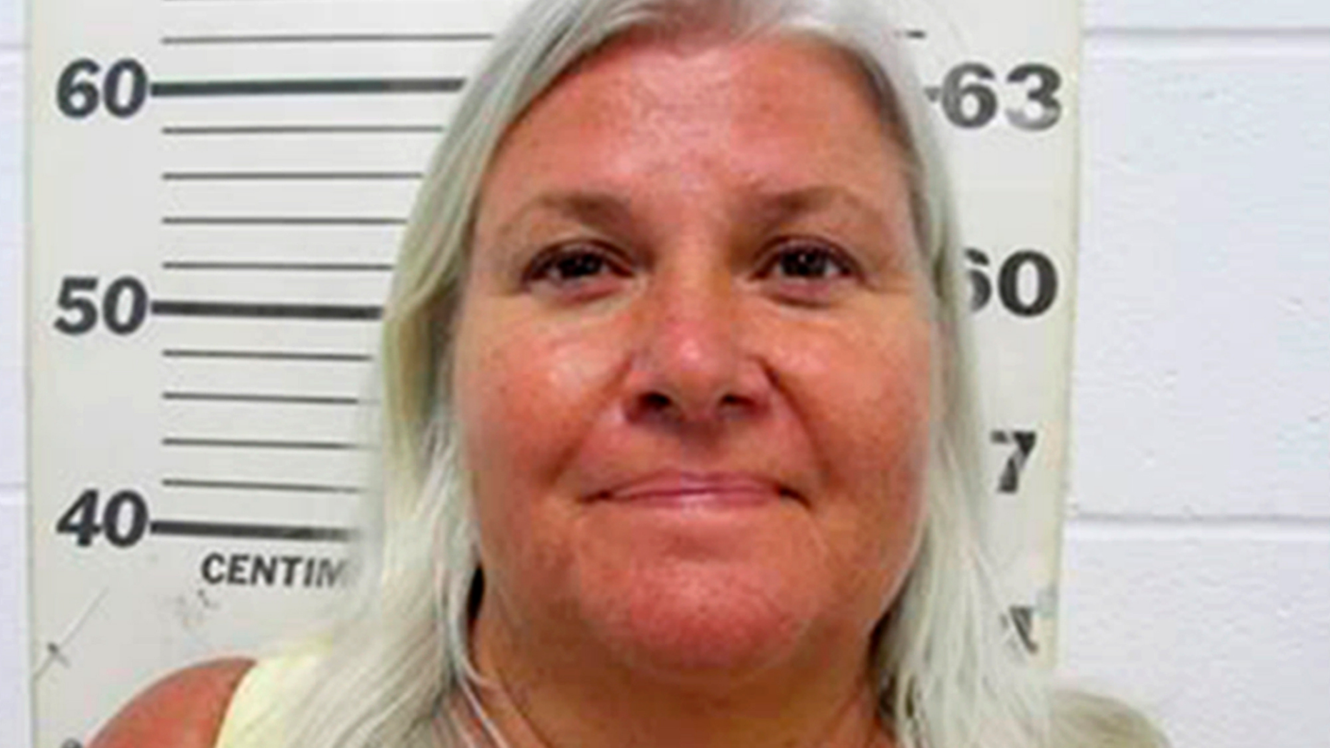 FILE - In this undated file photo provided by the South Padre Island, Texas, Police Department shows Lois Riess, of Blooming Prairie, Minn. A grand jury in Minnesota indicted the 57-year-old woman who authorities allege fatally shot her husband before fleeing to Florida and killing a woman there. Riess led authorities on a cross-country manhunt before she was captured in Texas on April 19, 2018, at a South Padre Island waterfront restaurant by two federal deputy marshals. (South Padre Island Police Department via AP, File)