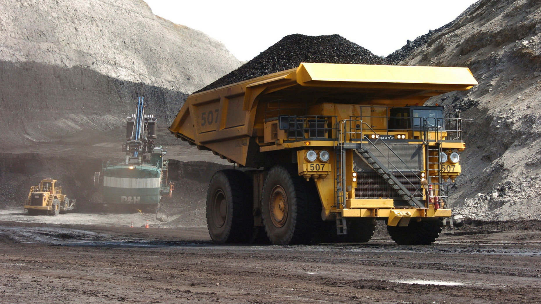 FILE - In this April 4, 2013, file photo, a truck carrying 250 tons of coal hauls the fuel to the surface of the Spring Creek mine near Decker, Mont. Federal officials say the Trump administration's decision to lift a moratorium on coal sales from public lands could hasten the release of more than 5 billion tons of greenhouse gasses. The report comes after a court ruled last month that the administration failed to consider the environmental effects of its resumption in 2017 of coal sales. A moratorium had been imposed under President Barack Obama over worries about climate change. (AP Photo/Matthew Brown, File)