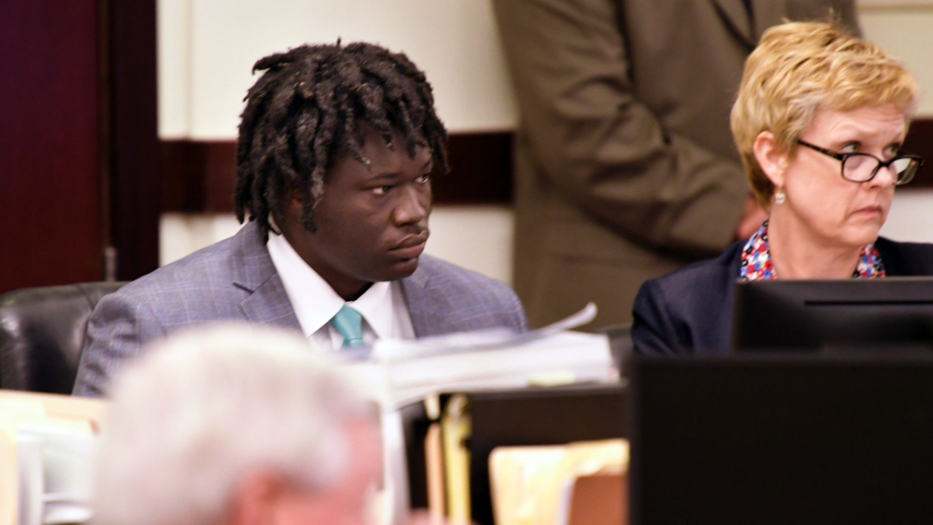 Emanuel Kidega Samson sits in court while the verdict is handed down in his murder trial on Friday, May 24, 2019 in Nashville, Tennessee. Samson was convicted of first-degree murder in a Nashville church shootout two years ago, leaving one woman dead and seven wounded. The jurors deliberated less than five hours before declaring Samson guilty on the 43 charges set out in the indictment. (Shelley Mays / The Tennessean via AP, Pool)