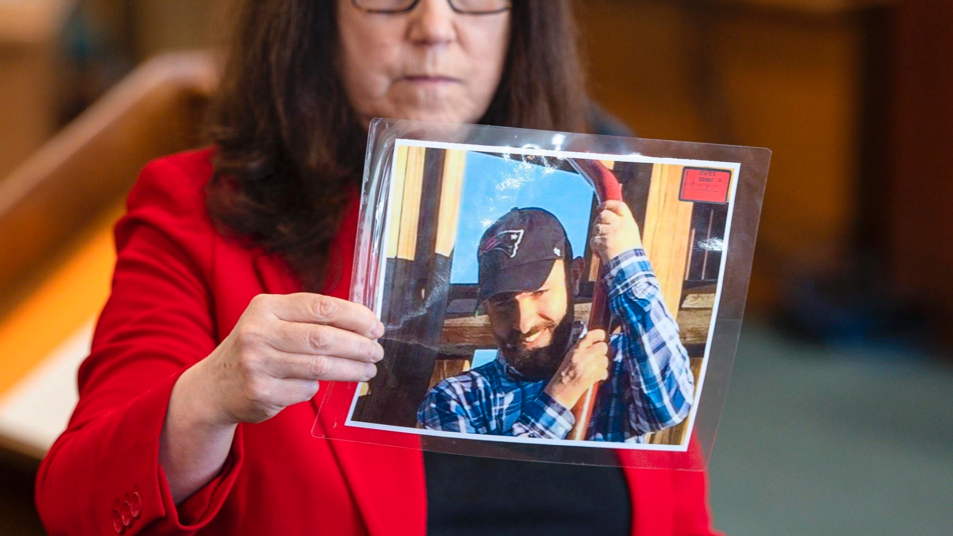 Prosecutor Susan Hardin shows a picture of Steven Bourgoin as he appeared in 2016 during his murder trial in Vermont Superior Court in Burlington on Monday, May 6, 2019. Bourgoin is facing five counts of second-degree murder for a crash that killed five teenagers on I-89 in Williston in 2016. (Glenn Russell/The Burlington Free Press via AP, Pool)