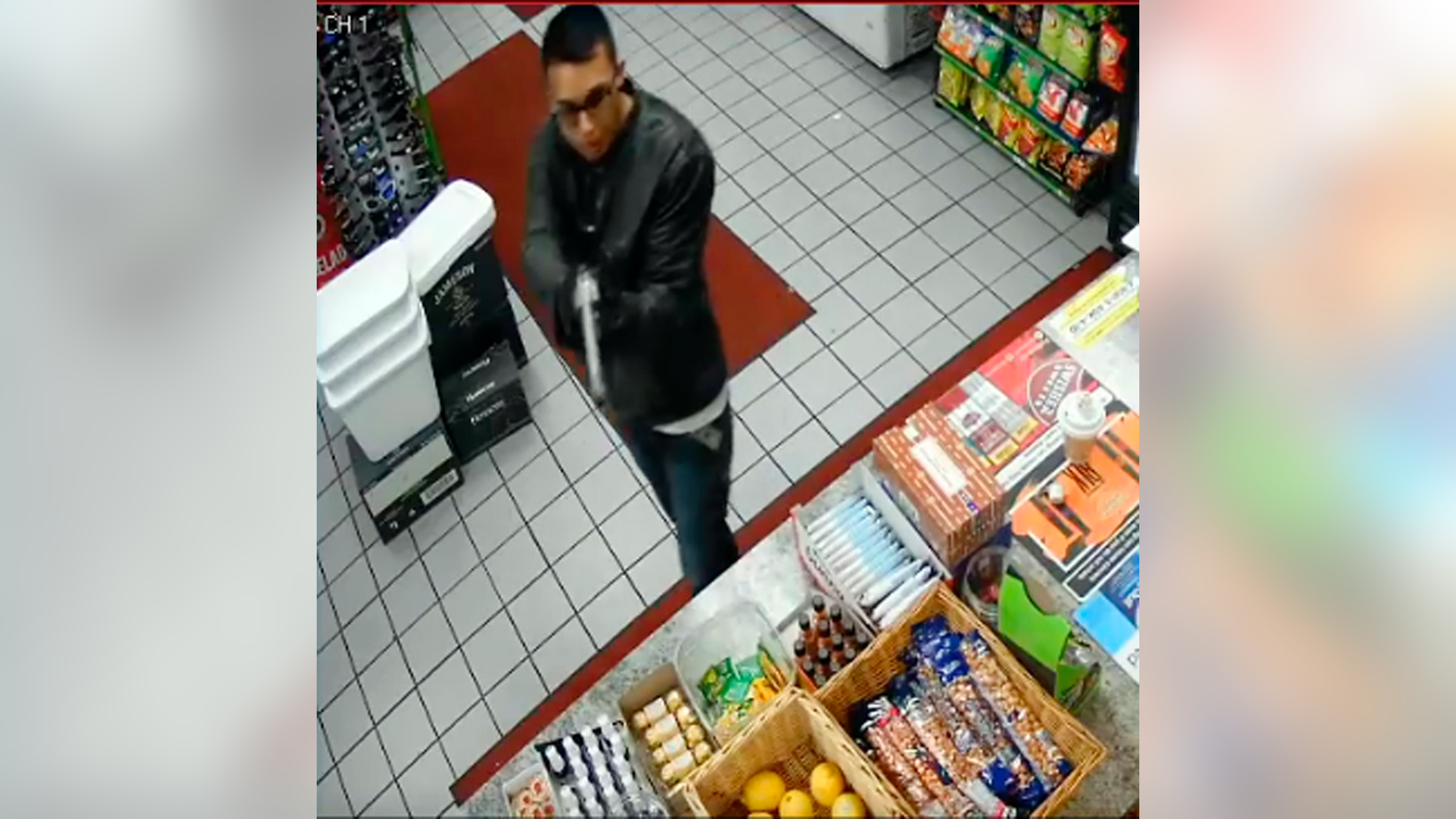 FILE - This Tuesday, May 7, 2019, file photo taken from surveillance video, released by the Downey, Calif., Police Department, shows the suspect in the murder of a Downey, Calif., liquor store owner as authorities sought the public's help in identifying him. Police say a man wounded in a car chase shootout in Southern California Friday, May 10, is suspected of killing a liquor store owner days earlier. The man was dragged unmoving from the car on Friday afternoon after a chase that began in Downey. (Downey Police Department via AP)
