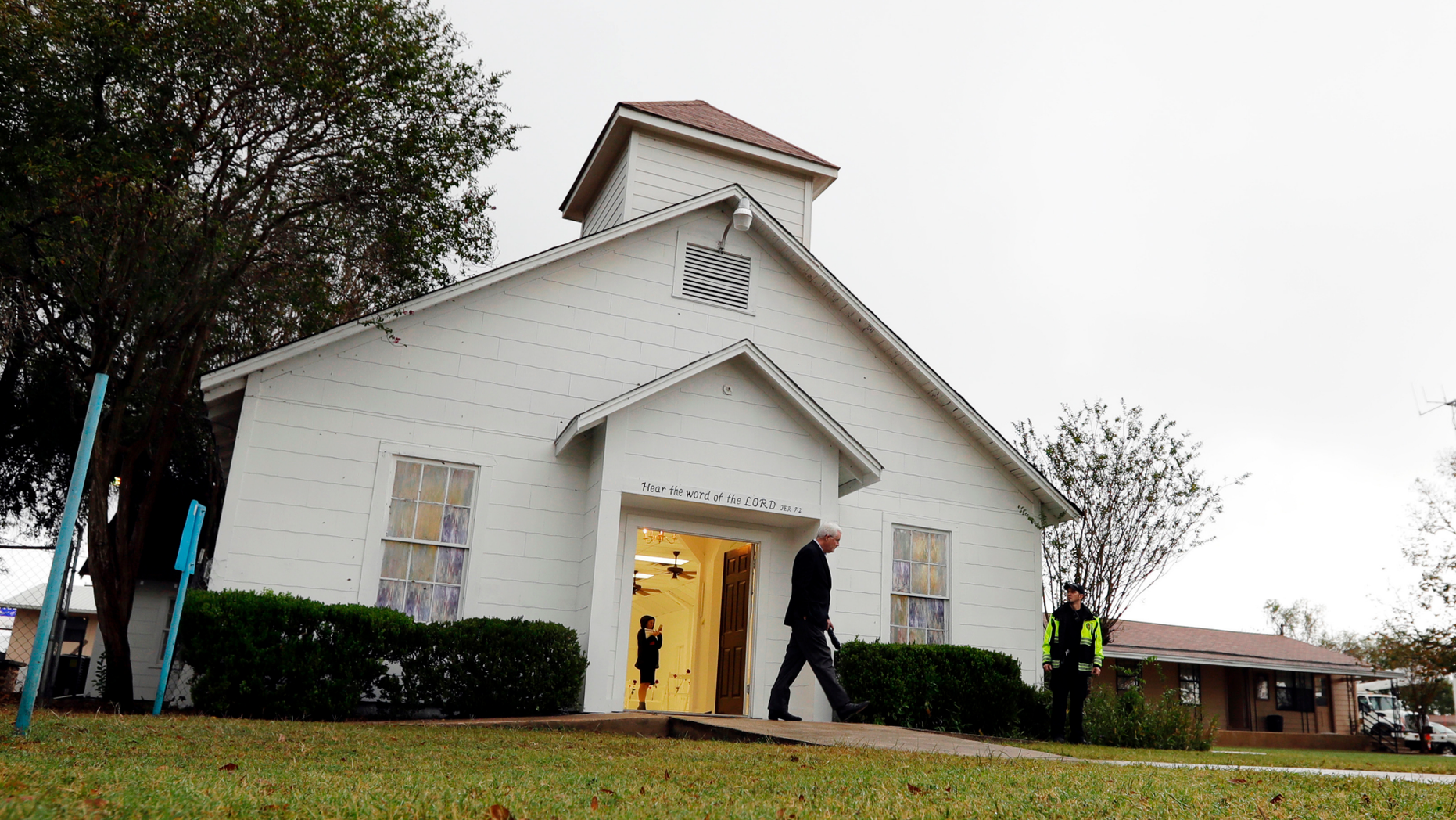 FILE - In this Nov. 12, 2017, file photo, a man walks out of the memorial for the victims of a shooting at Sutherland Springs First Baptist Church in Sutherland Springs, Texas. A South Texas church where a gunman in 2017 opened fire and killed more than two dozen congregants will unveil a new sanctuary and memorial room honoring the victims. Worshippers and relatives of those killed or injured at the First Baptist Church in Sutherland Springs are expected to gather at the newly constructed church on Sunday, May 19, 2019. (AP Photo/Eric Gay, File)