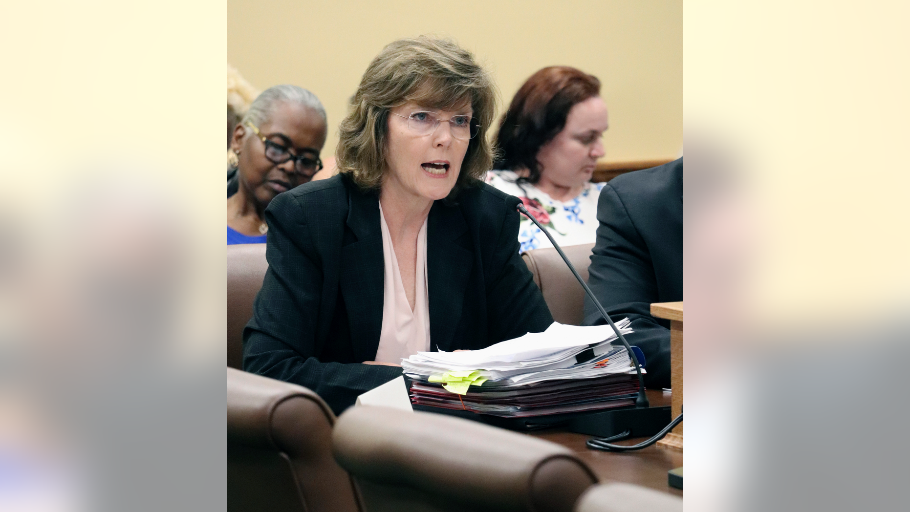 FILE - In this June 14, 2018 file photo, Arkansas Department of Correction Director Wendy Kelley testifies before legislators at the state Capitol in Little Rock, Ark. A federal trial over Arkansas' use of a sedative in lethal injections is wrapping up in Little Rock following testimony from the state's prisons director. Kelley testified Wednesday, May 1, 2019, about her role overseeing four executions that occurred over a two-week span in 2017. (AP Photo/Kelly P. Kissel, File)