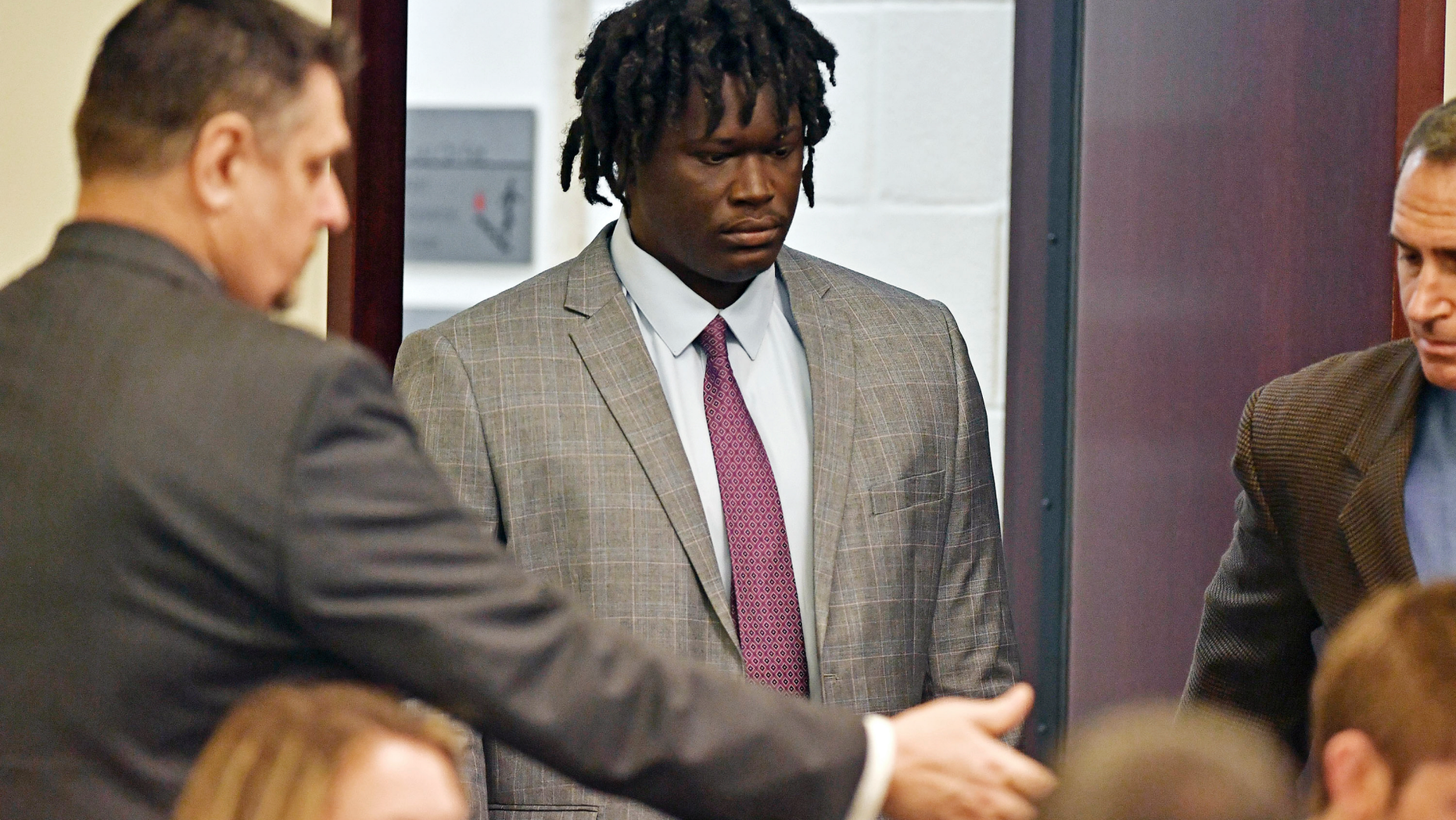 FILE - In this May 20, 2019, file photo, Emanuel Kidega Samson, 27, center, enters the courtroom in Nashville, Tenn. Samson, accused of fatally shooting one person and wounding seven others in a Nashville church in 2017, said Wednesday, May 22, he can't remember if he did it. (George Walker IV/The Tennessean via AP, Pool, File)
