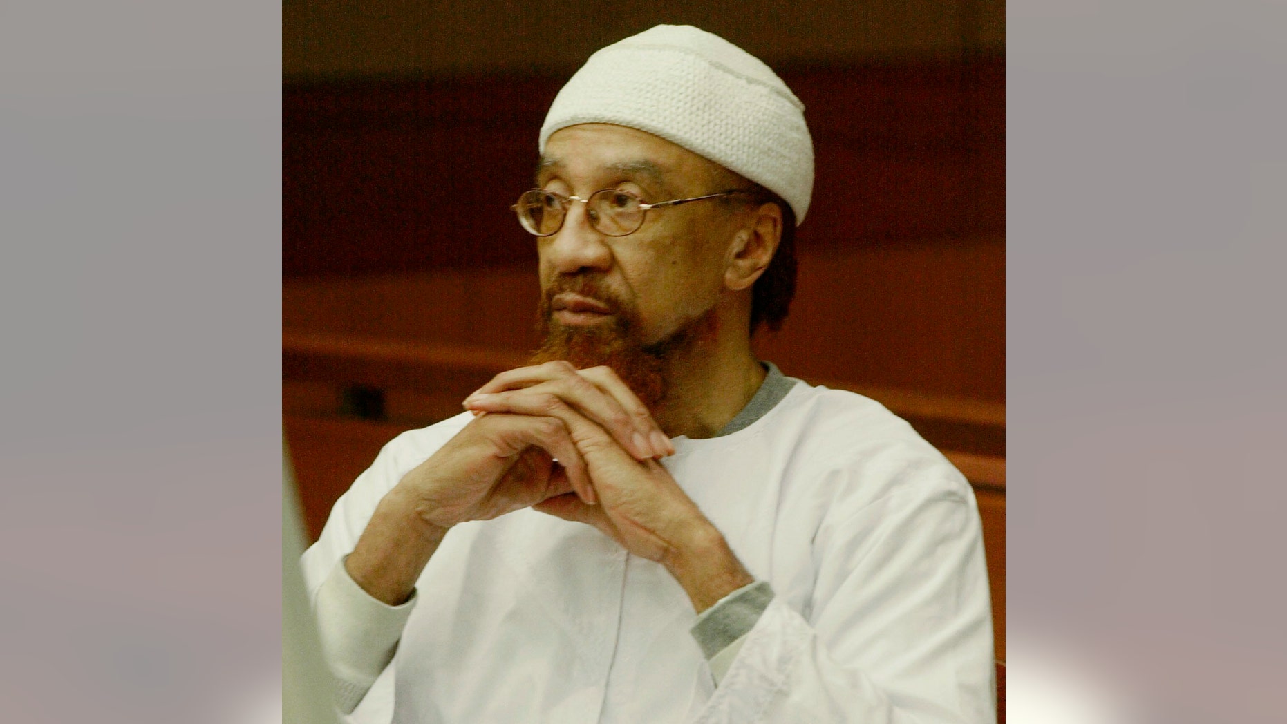 FILE- In this March 11, 2002 file photo, Jamil Abdullah Al-Amin watches during the sentencing portion of his trial in Atlanta. Al-Amin, the militant civil rights leader known in the 1960s as H. Rap Brown who was convicted of killing Fulton County Sheriff's Deputy Ricky Kinchen and wounding Deputy Aldranon English in a shootout in March 2000, is challenging his imprisonment, saying his constitutional rights were violated at trial. (AP Photo/Ric Feld, File)