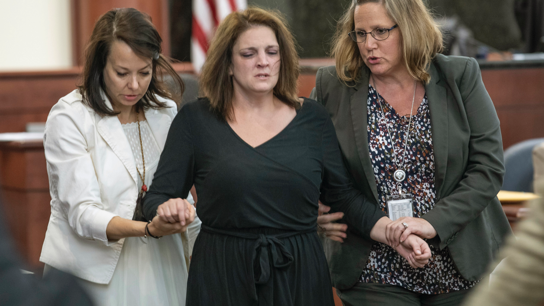 CORRECTS TOWN TO COLUMBIA NOT LEXINGTON - Amber Kyzer is helped out of the courtroom after breaking down on the witness stand while being questioned during the trial of her ex-husband, Tim Jones, in Columbia, S.C., Monday, May 20, 2019. Timothy Jones, Jr. is accused of killing their 5 young children in 2014. Jones, who faces the death penalty, has pleaded not guilty by reason of insanity. (Tracy Glantz/The State via AP, Pool)