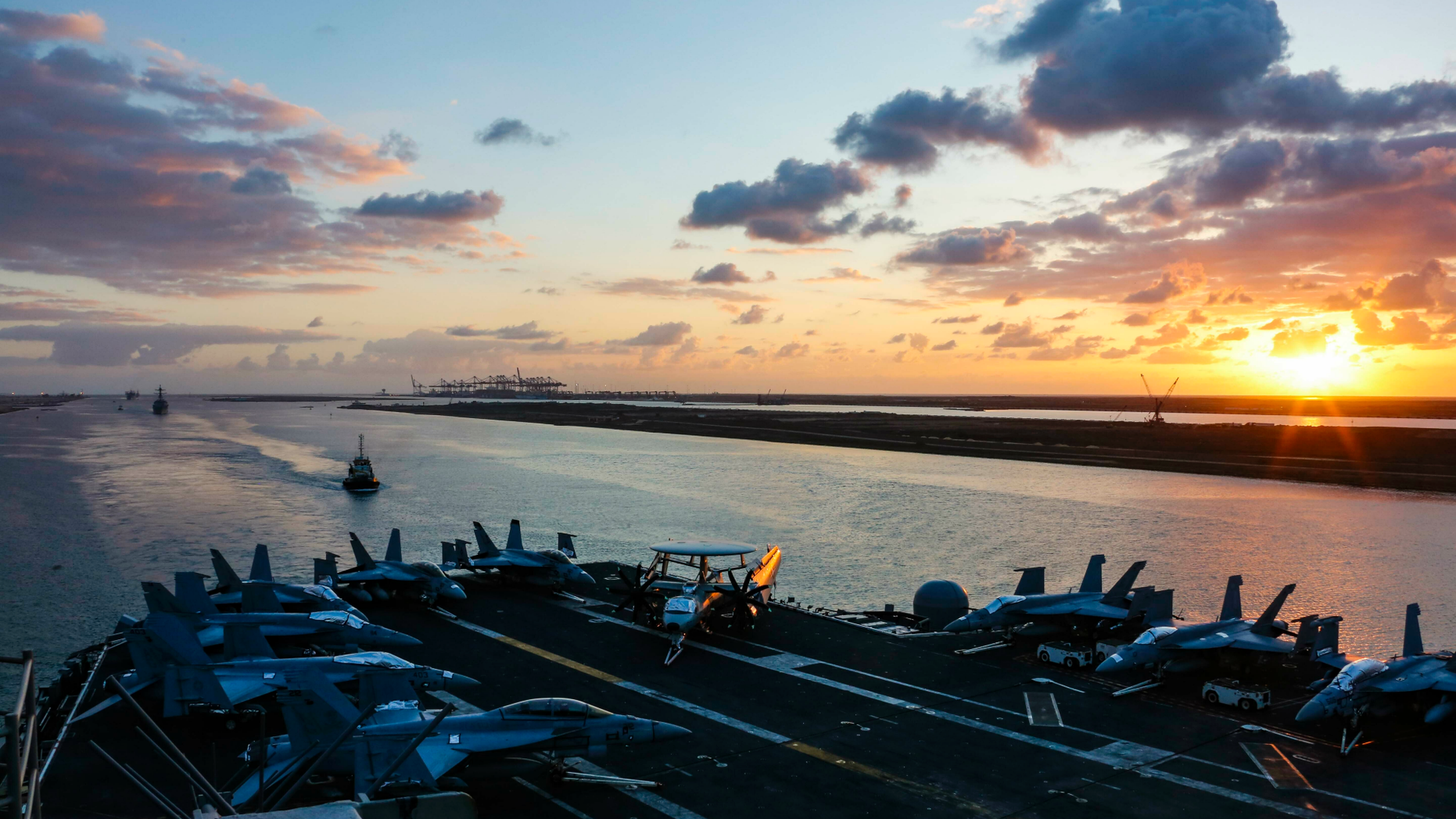 In this Thursday, May 9, 2019 photo released by the U.S. Navy, the Nimitz-class aircraft carrier USS Abraham Lincoln transits the Suez Canal in Egypt. The aircraft carrier and its strike group are deploying to the Persian Gulf on orders from the White House to respond to an unspecified threat from Iran. (Mass Communication Specialist Seaman Dan Snow, U.S. Navy via AP)
