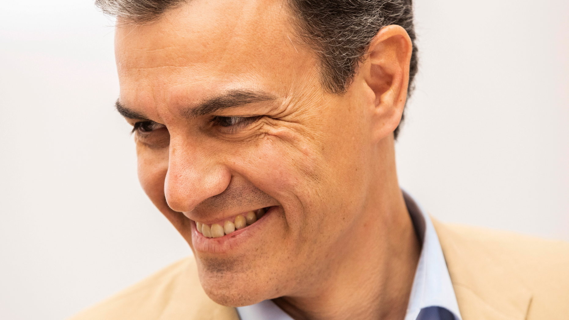 Spain's Prime Minister Pedro Sanchez smiles during a party meeting at Socialist party headquarters in Madrid, Spain, Monday, April 29, 2019. Spain's political future is no clearer after a third election since 2015, with experts saying Monday that it won't be anytime soon before the muddle is resolved. The incumbent prime minister, Pedro Sanchez, celebrated after his Socialist party won the most votes in Sunday's ballot. But Spanish politicians were doing the math on how Sanchez might survive the next four years without a parliamentary majority. (AP Photo/Bernat Armangue)