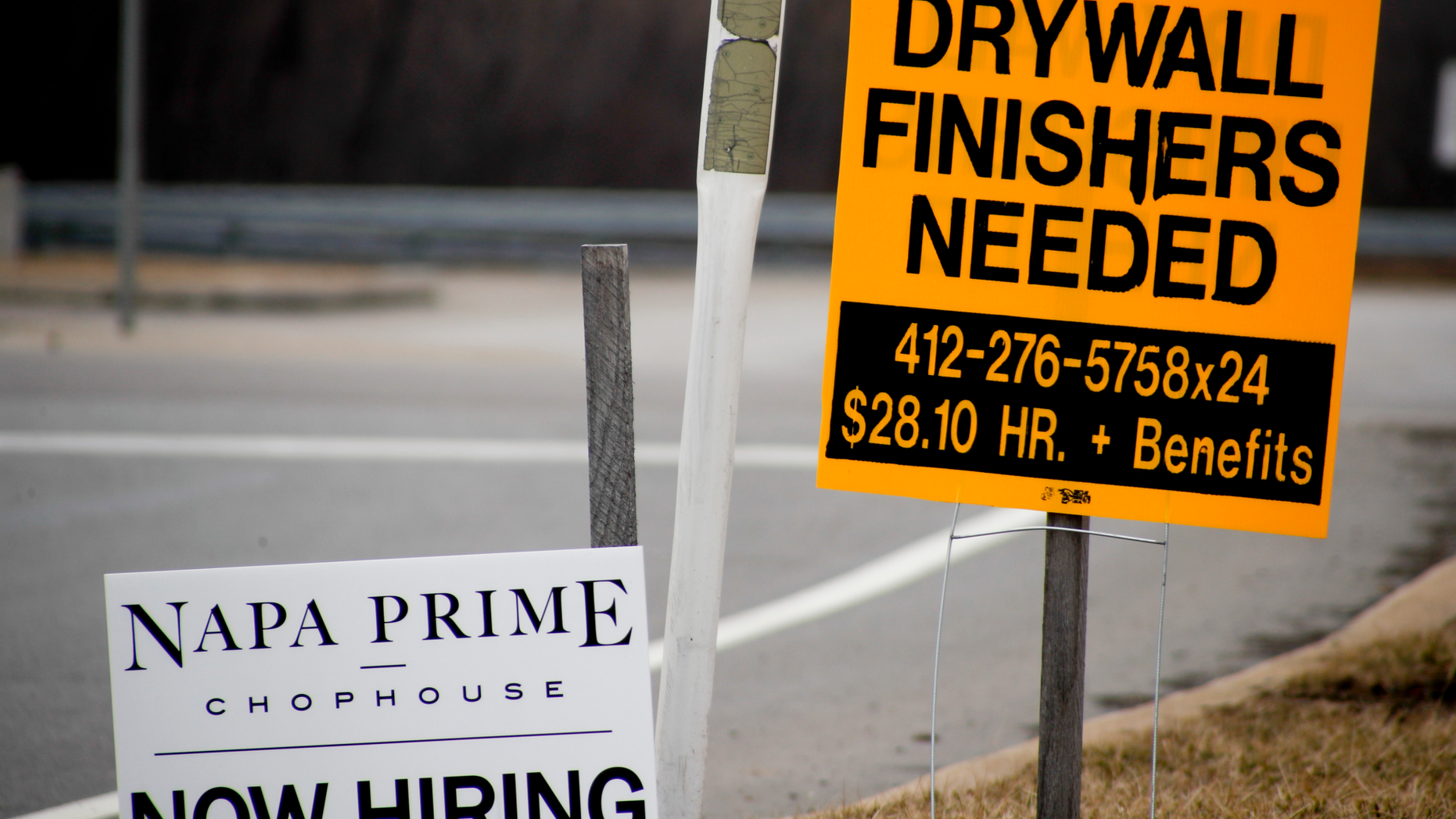 In this March 1, 2019, photo signs for employment opportunities are posted at an exit ramp off of Interstate 79 in Zelienople, Pa. On Tuesday, May 7, the Labor Department reports on job openings and labor turnover for March. (AP Photo/Keith Srakocic)