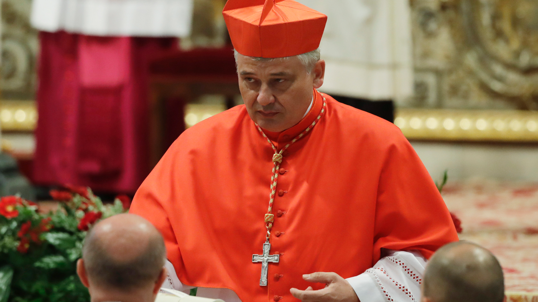 FILE - In this Thursday, June 28, 2018 filer, Cardinal Konrad Krajewski right after being elected in a consistory in St. Peter's Basilica at the Vatican. Pope Francis' almsgiver has gone down a Rome manhole to restore electricity for hundreds of homeless people living in an unused state-owned building. Polish Cardinal Konrad Krajewski told Italian news agency ANSA he went underground and flipped a power switch Saturday in a "desperate gesture" to help the building's more than 400 occupants . (AP Photo/Alessandra Tarantino, File)