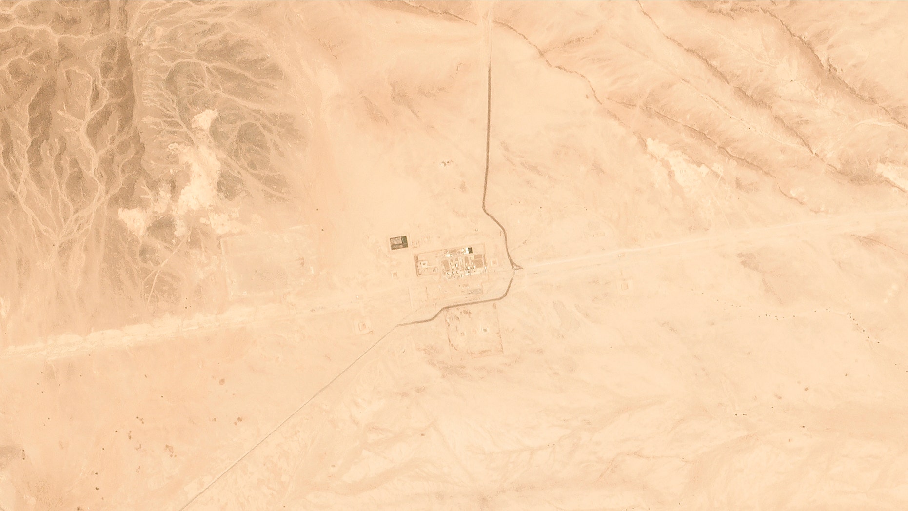 This satellite image provided by Planet Labs Inc. shows Saudi Aramco's Pumping Station No. 8 near al-Duadmi, Saudi Arabia, Tuesday, May 14, 2019, after what the kingdom described as a drone attack on the facility. An oil pipeline that runs across Saudi Arabia was hit Tuesday by drones, the Saudi energy minister said, as regional tensions flared just days after what the kingdom called an attack on two of its oil tankers elsewhere in the Mideast. (Satellite image © 2019 Planet Labs Inc. via AP)