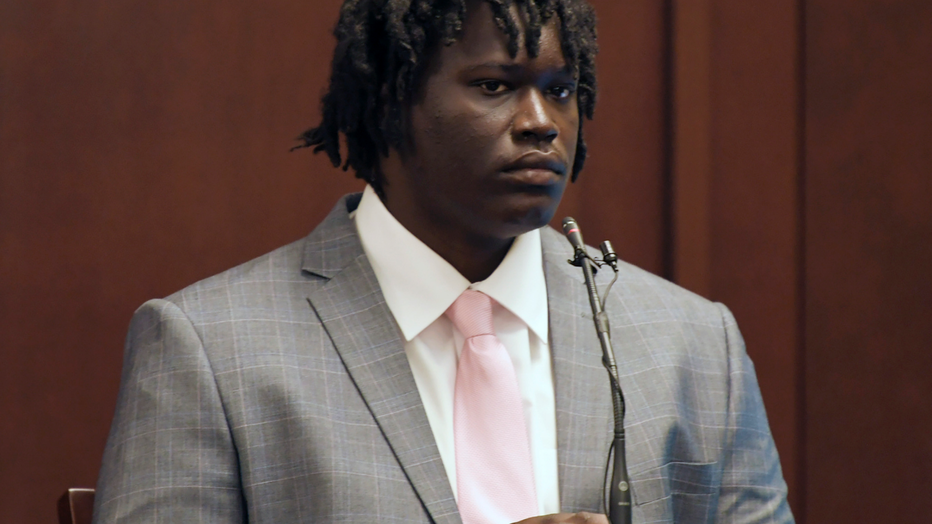 Emanuel Kidega Samson testifies in his own defense Wednesday, May 22, 2019, in Nashville, Tenn. Samson is accused of fatally shooting a woman and wounding seven people at a Nashville church in 2017. Prosecutors have said they're seeking life without parole for Samson. (Shelley Mays/The Tennessean via AP, Pool)