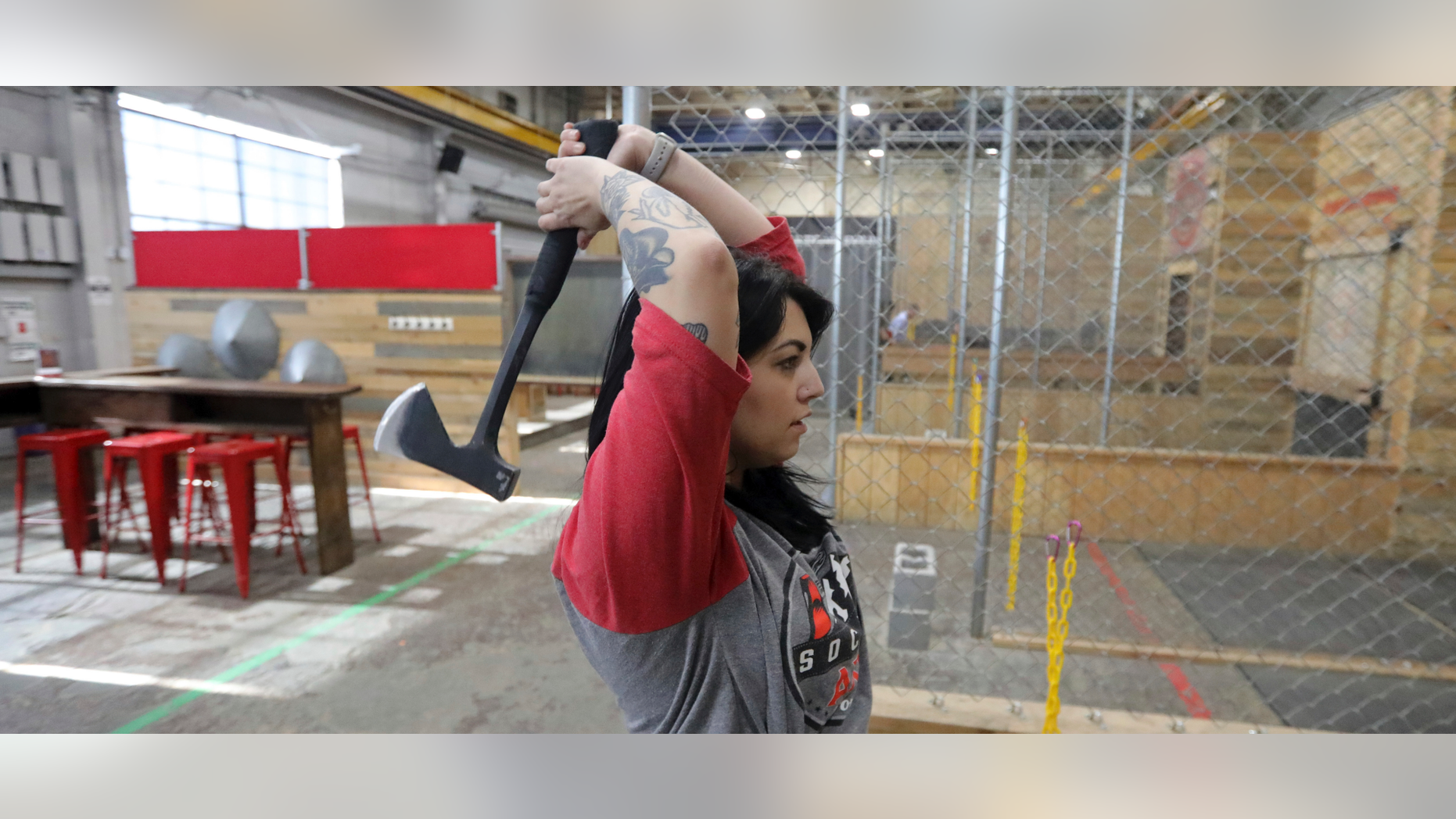 General manager Devan Watanabe throws an axe at Social Axe Throwing Wednesday, May 1, 2019, in Salt Lake City. The Utah Department of Alcoholic Beverage Control announced Tuesday, April 30, 2019, that beer will not be allowed at a Salt Lake City karaoke business or an Ogden ax-throwing venue because neither fits the 14 definitions of a "recreational amenity,"under a new law passed by Utah's Republican-controlled legislature during the yearly session that ended in March. (AP Photo/Rick Bowmer)