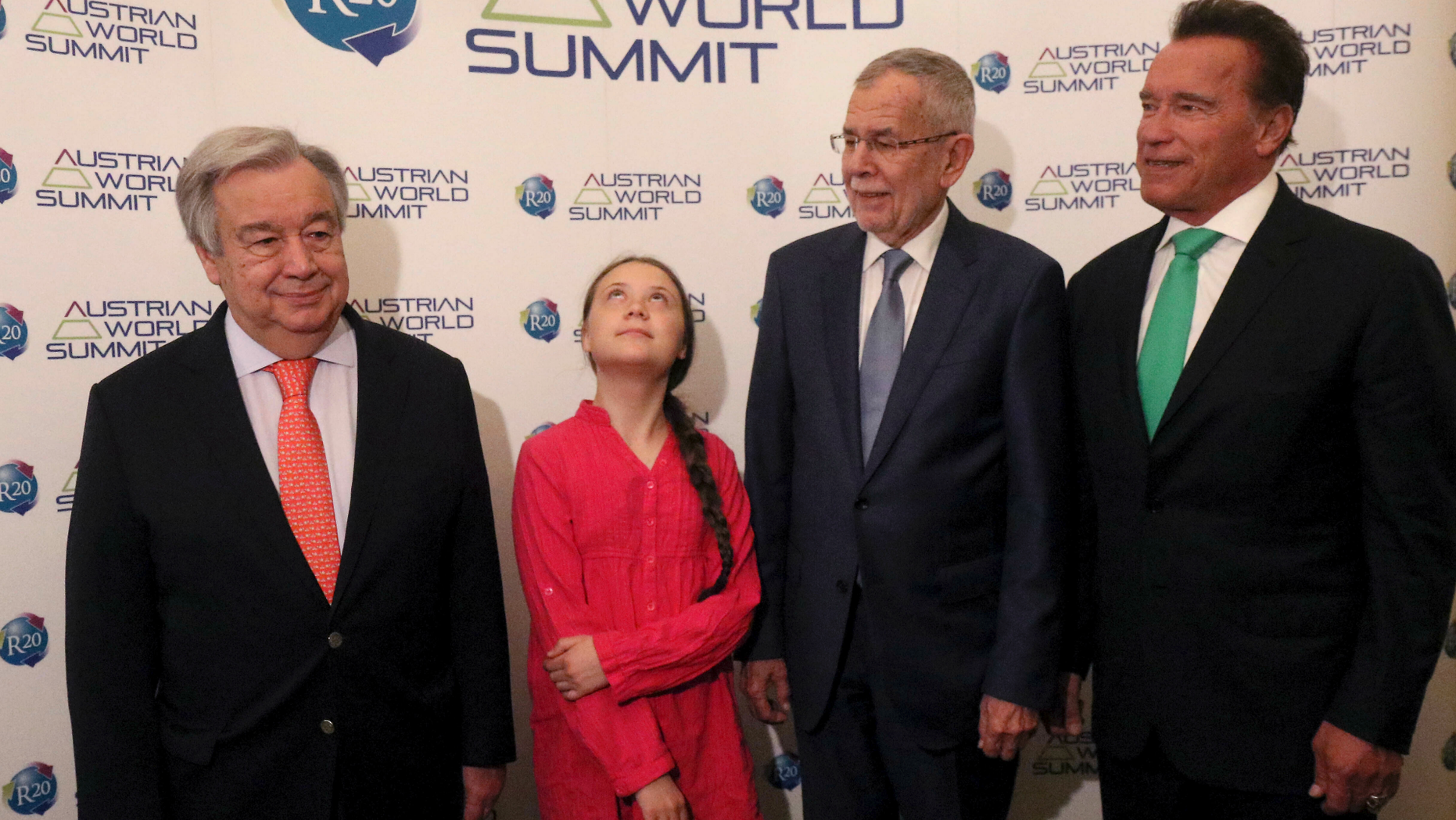 United Nations Secretary-General Antonio Guterres, Swedish climate activist Greta Thunberg, Austrian President Alexander Van der Bellen and former California Gov. Arnold Schwarzenegger, from left, pose before the R20 Austrian world summit at Hofburg palace in Vienna, Austria, Tuesday, May 28, 2019. (AP Photo/Ronald Zak)
