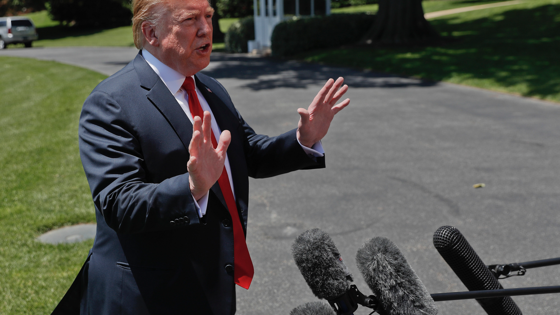 President Donald Trump speaks to members of the media on the South Lawn of the White House in Washington, Friday, May 24, 2019, before boarding Marine One for a short trip to Andrews Air Force Base, Md., and then on to Tokyo. (AP Photo/Pablo Martinez Monsivais)