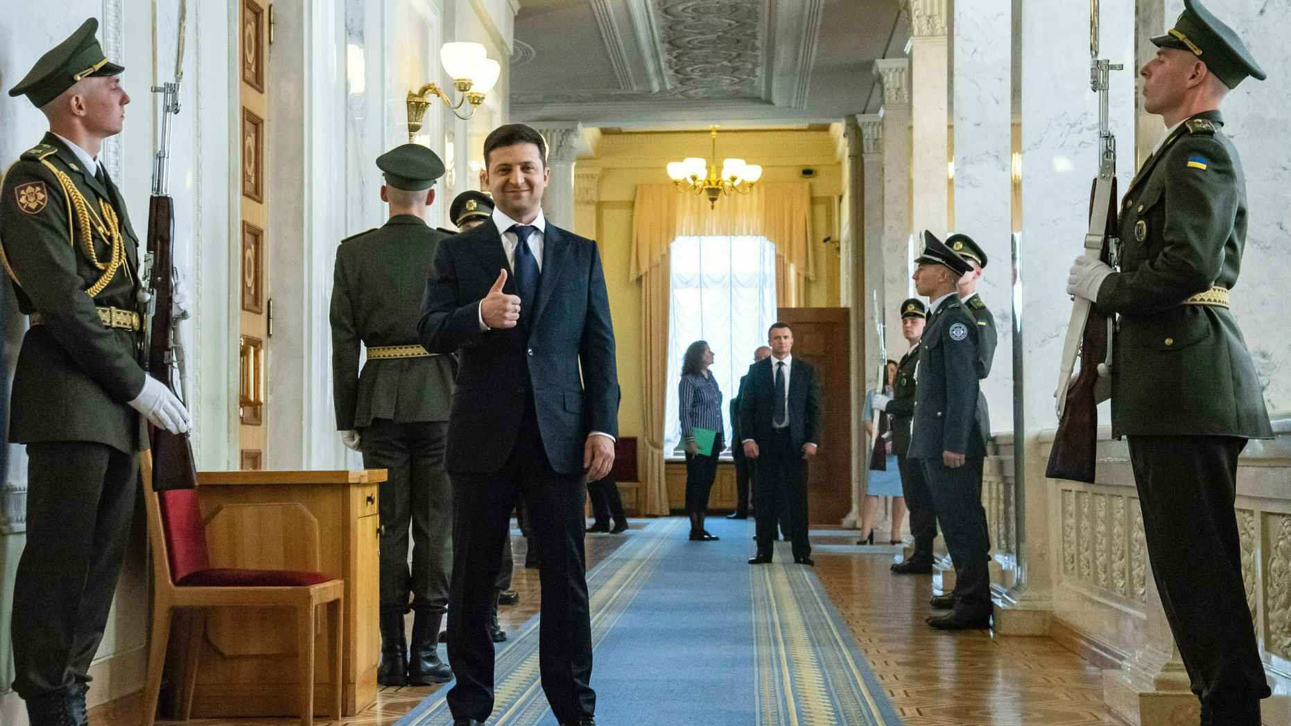Ukrainian President-elect Volodymyr Zelenskiy, center, gestures as he waits to attend his inauguration ceremony in Kiev, Ukraine, Monday, May 20, 2019. Ukrainian TV star Volodymyr Zelenskiy has sought to capitalize on his huge popularity, dissolving the country's parliament Monday minutes after he was sworn in as president. (AP Photo/Zoya Shu, Pool)