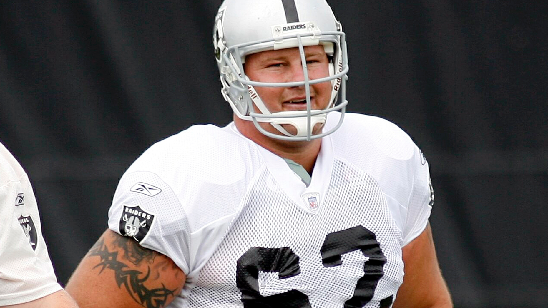 FILE - This July 28, 2007, file photo shows then Oakland Raiders center, Jeremy Newberry during workouts at the team's training camp in Napa, Calif. Newberry says, Sunday, May 19, 2019, vandals have destroyed nearly half of the 4,000 cherry trees recently planted at his Northern California orchard. (AP Photo/Dino Vournas, File)