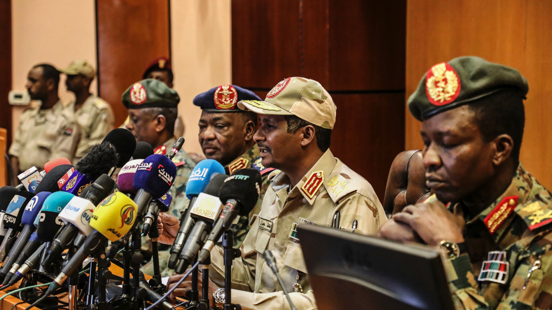 FILE - In this April 30, 2019 file photo, Gen. Mohamed Hamdan Dagalo, the deputy head of the military council, second right, speaks at a press conference in Khartoum, Sudan. As the uprising against Sudanese President Omar al-Bashir gained strength, Egypt, the United Arab Emirates and Saudi Arabia began reaching out to the military through secret channels to encourage his removal from power. (AP Photo)