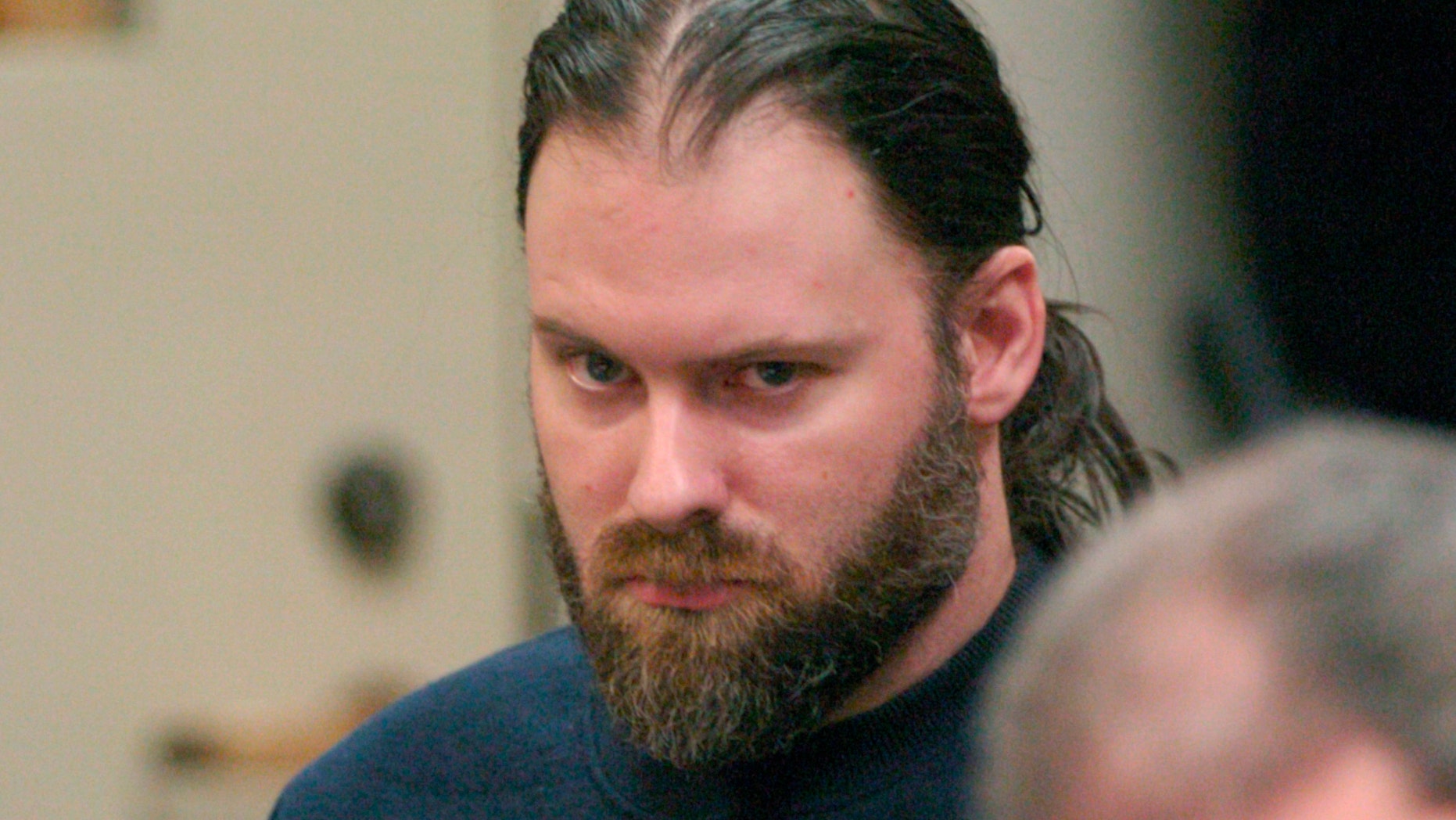 FILE - In this Jan. 26, 2006, file photo, Mark Hulett appears in Vermont District Court in Burlington, Vt. Hulett, whose initial 60-day sentence for a conviction of having sex with a child prompted a nation-wide outcry, is facing a federal charge of possession of child pornography. Federal court documents say 48-year-old Hulett, of Ferrisburgh, Vt., was charged Tuesday, May 14, 2019, after law enforcement agents searched his home. (Glenn Russell/The Burlington Free Press via AP, Pool, File)