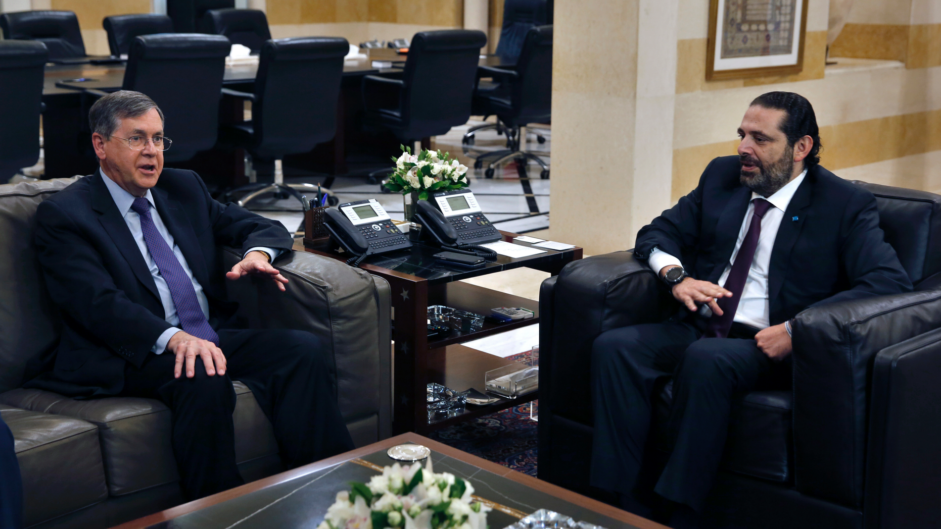 U.S. Deputy Assistant Secretary of State David Satterfield, left, speaks during his meeting with Lebanese Prime Minister Saad Hariri, in Beirut, Lebanon, Tuesday, May 14, 2019. Satterfield's visit comes a week after President Michel Aoun presented the U.S. ambassador to Lebanon with a "unified stance" regarding the demarcation of maritime border between Lebanon and Israel. (AP Photo/Bilal Hussein)