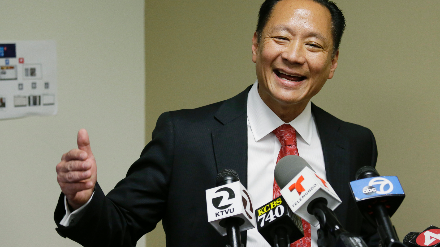 FILE - In this April 26, 2016, file photo, San Francisco Public Defender Jeff Adachi gestures during a news conference in San Francisco. Bryan Carmody, a San Francisco reporter, is seeking the return of property after police raided his home with a sledgehammer, as officials sought to determine the source of a leaked police report into Adachi's death. An attorney for Carmody will make the request Tuesday, May 21, 2019, in San Francisco County Superior Court. (AP Photo/Eric Risberg, File)