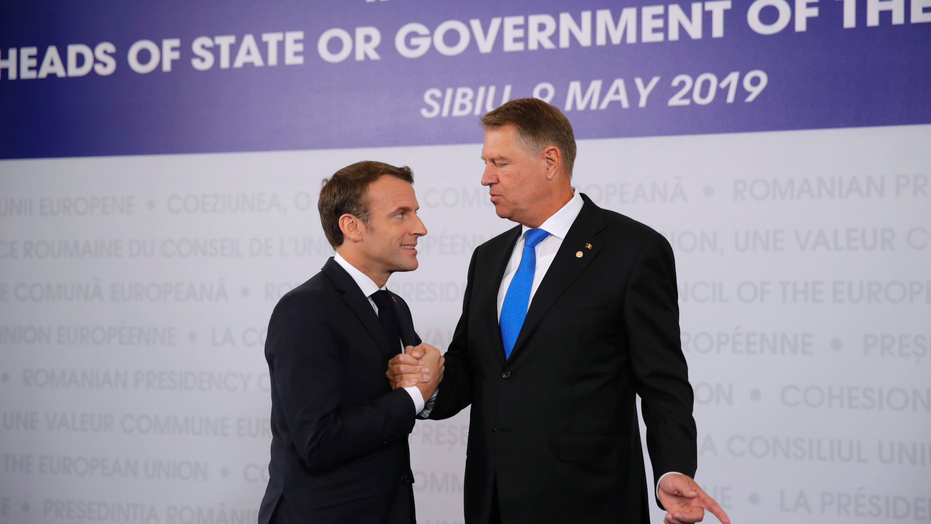 French President Emmanuel Macron, left, is welcomed by Romanian President Klaus Werner Ioannis as he arrives for an EU summit in Sibiu, Romania, Thursday, May 9, 2019. European Union leaders on Thursday start to set out a course for increased political cooperation in the wake of the impending departure of the United Kingdom from the bloc. (AP Photo/Vadim Ghirda)