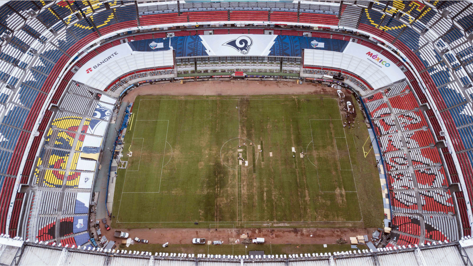 FILE - In this Nov. 13, 2018 file photo, Mexico's Azteca Stadium is seen from above in Mexico City. Officials at the Stadium said Monday, May 27, 2019, that they will convert the field back to natural turf after a failed attempt at a hybrid playing surface led to the cancellation of a scheduled NFL game there last year. (AP Photo/Christian Palma, File)
