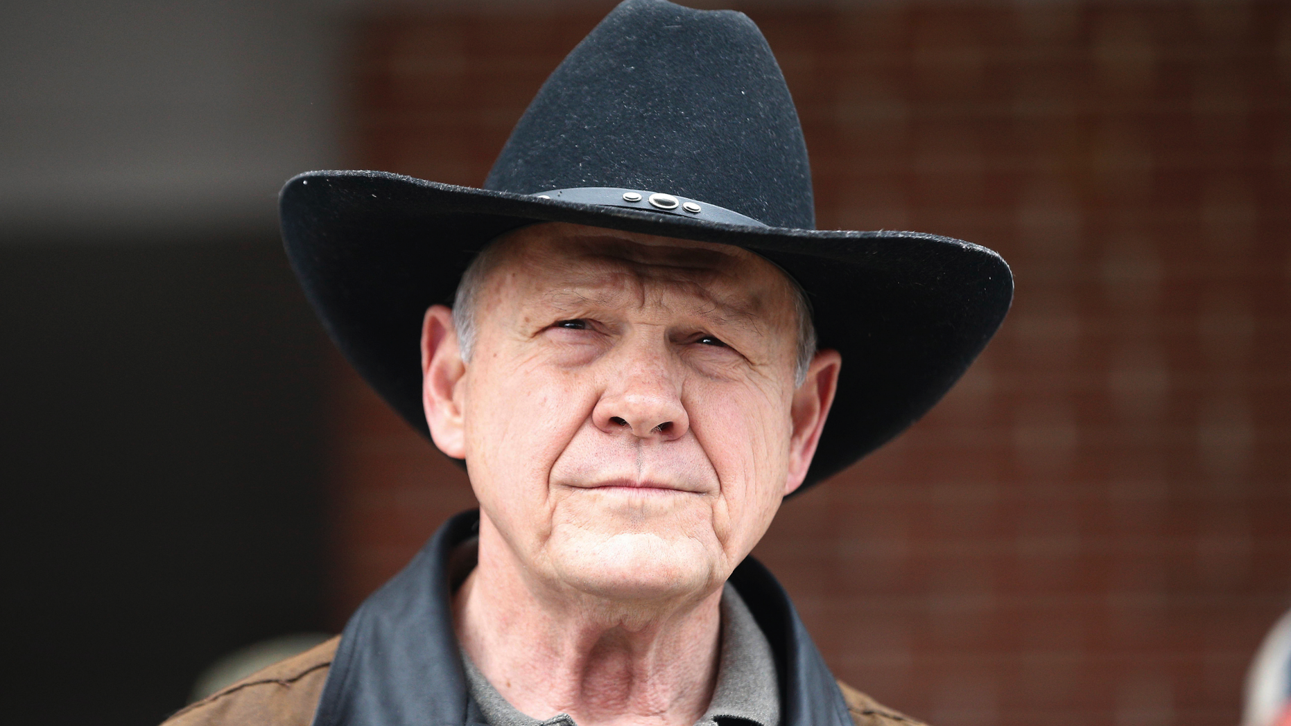 FILE - In this Dec. 12, 2017, file photo, Roy Moore speaks to the media after he rode in on a horse to vote in Gallant, Ala. Moore says he’s considering a fresh run for Senate in 2020. That’s prompting national Republican leaders to signal that they’d try again to prevent their party from nominating Moore, who’s denied long-ago sexual impropriety with teenagers. (AP Photo/Brynn Anderson, File)