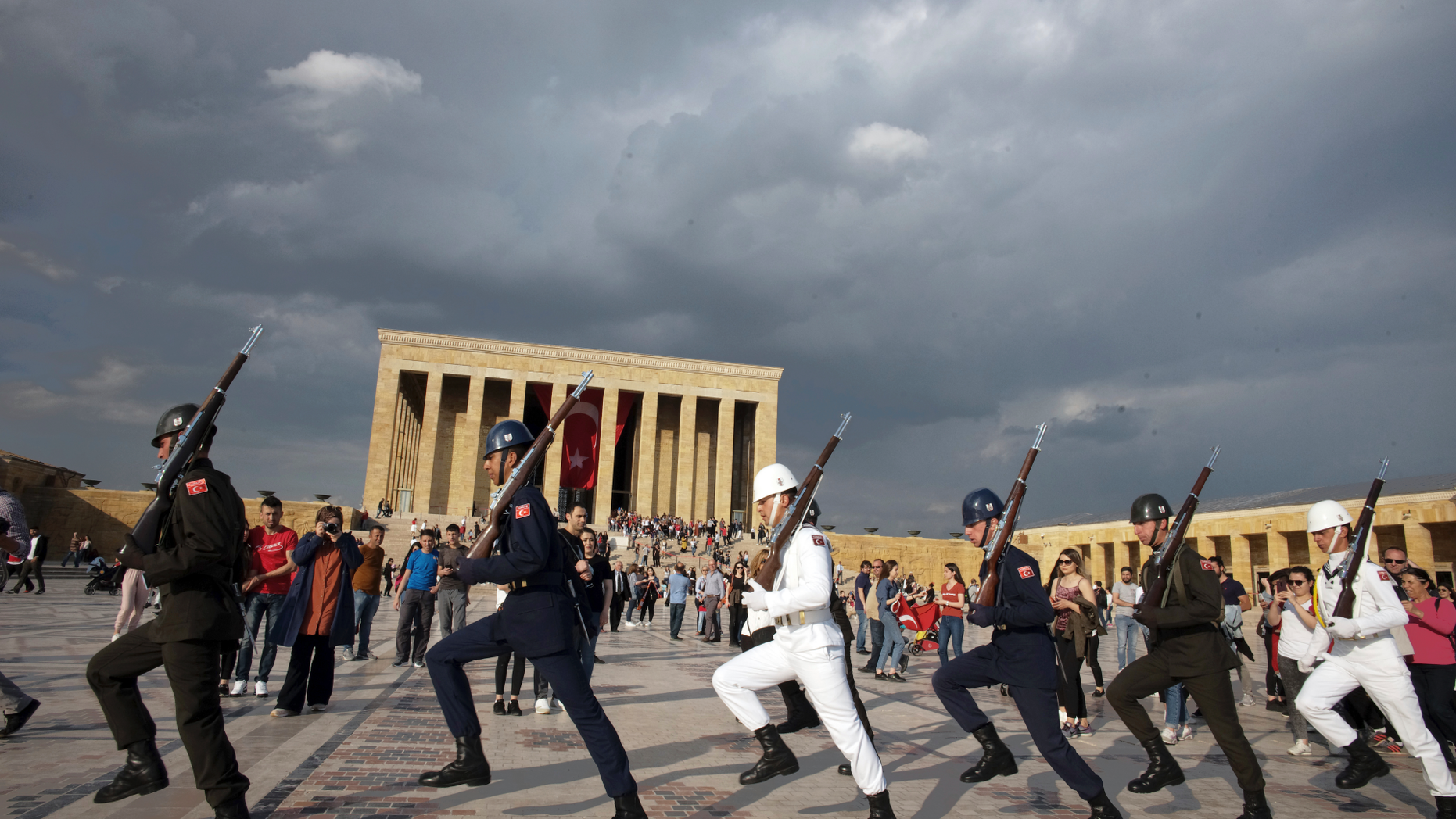 Soldiers march during a changing of guard ceremony as thousands of people visit the mausoleum of Mustafa Kemal Ataturk, the founder of modern Turkey, to pay respect on the day marking the 100th anniversary of the start of Turkey's War of Independence under the leadership of young Ottoman army general, Mustafa Kemal (Ataturk), 38, in Ankara, Turkey, Sunday, May 19, 2019.(AP Photo/Burhan Ozbilici)