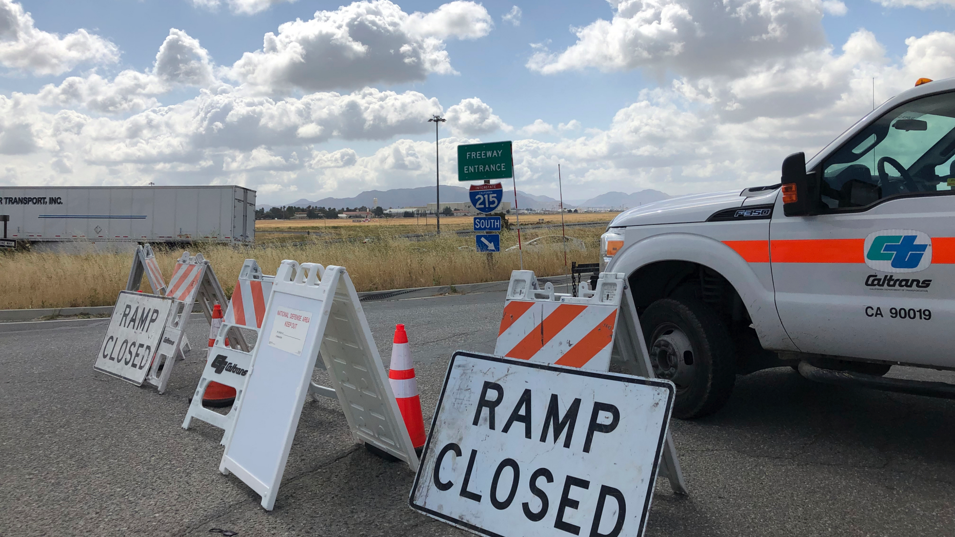 An on ramp to Interstate 215 is closed off on Friday, May 17, 2019, in California. A wide area including the 215 freeway remained off-limits around an F-16 fighter jet crash site in Southern California on Friday as military and civilian authorities investigated. (AP Photo/Amy Taxin)