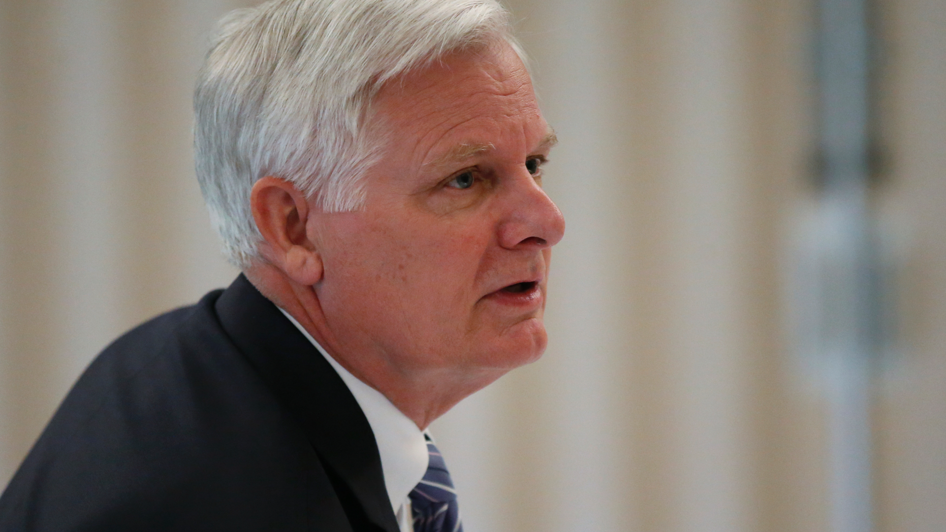 FILE - In this Thursday, May 9, 2019, file photo, University of Oklahoma President James L. Gallogly is pictured before a Board of Regents meeting in Norman, Okla. Gallogly, a former energy industry executive who came out of retirement to succeed David Boren as the university's president, said in a statement released Sunday, May 12, that he has advised the university's regents of his plans to retire once they have a transition plan in place. He took on the position last year. (AP Photo/Sue Ogrocki, File)