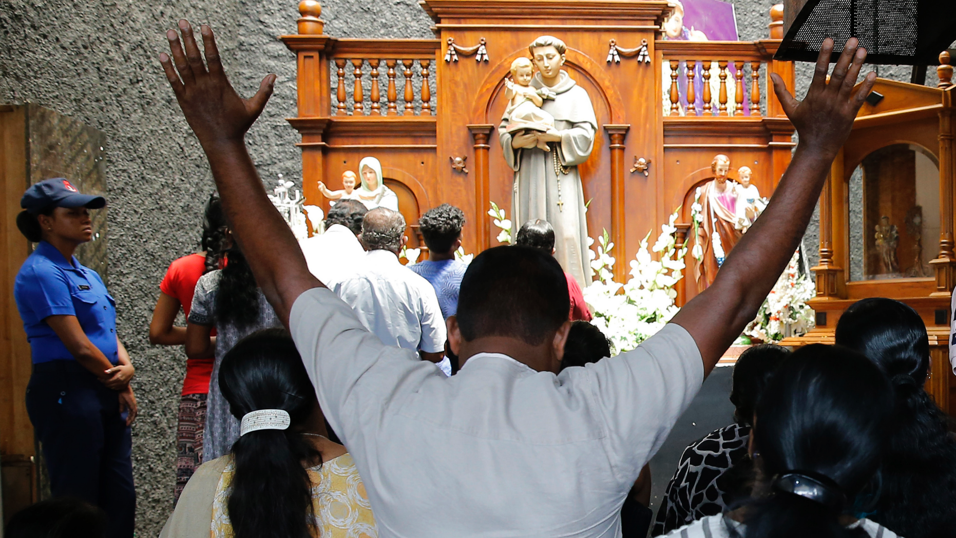 Catholic devotees pray at the St. Anthony's church after it was partially opened for the first time since Easter Sunday attacks, in Colombo, Sri Lanka, Tuesday, May 7, 2019. Two bomb experts were among the suicide attackers who struck churches and hotels on Easter in Sri Lanka and all those directly involved in the bombings are either dead or under arrest, police said. (AP Photo/Eranga Jayawardena)