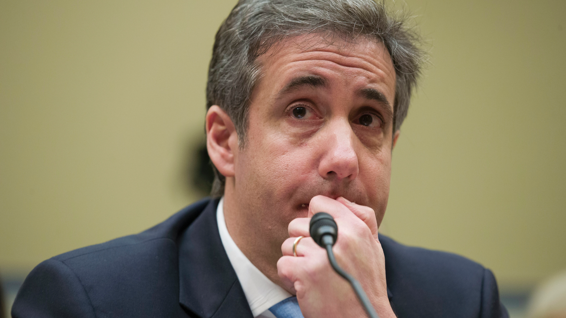 FILE - In this Feb. 27, 2019, photo, President Donald Trump's former personal lawyer Michael Cohen listens to a question while testifying before the House Oversight and Reform Committee, on Capitol Hill, in Washington DC. On May 6 , 2019, Cohen is scheduled to begin a three-year sentence at the Federal Correctional Institution, Otisville in Mount Hope, N.Y., for tax evasion, lying to Congress and campaign finance crimes. (AP Photo/Alex Brandon, File)