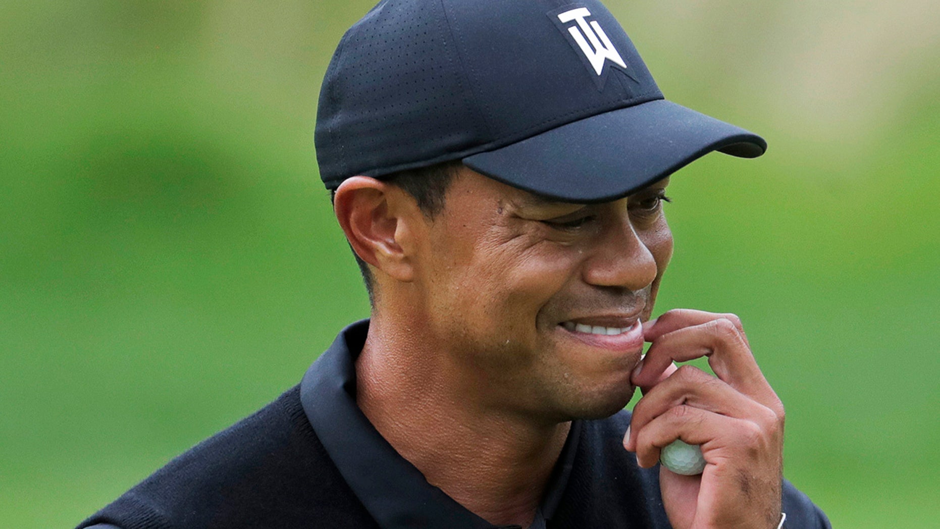 Tiger Woods reacts as he walks off the 7th green during the second round of the PGA Championship golf tournament, Friday, May 17, 2019, at Bethpage Black in Farmingdale, N.Y. (AP Photo/Julio Cortez)