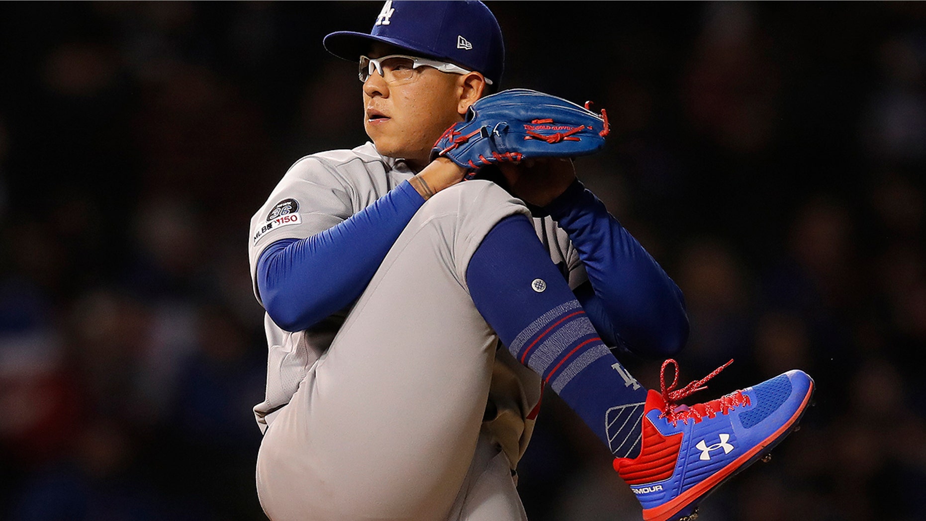 Los Angeles Dodgers' Julio Urias pitches against the Chicago Cubs during the first inning of a baseball game in Chicago. Los Angeles police say Urias was arrested Monday evening, May 13, 2019, for investigation of misdemeanor domestic battery. No details of the incident were released. (AP Photo/Jim Young,File)