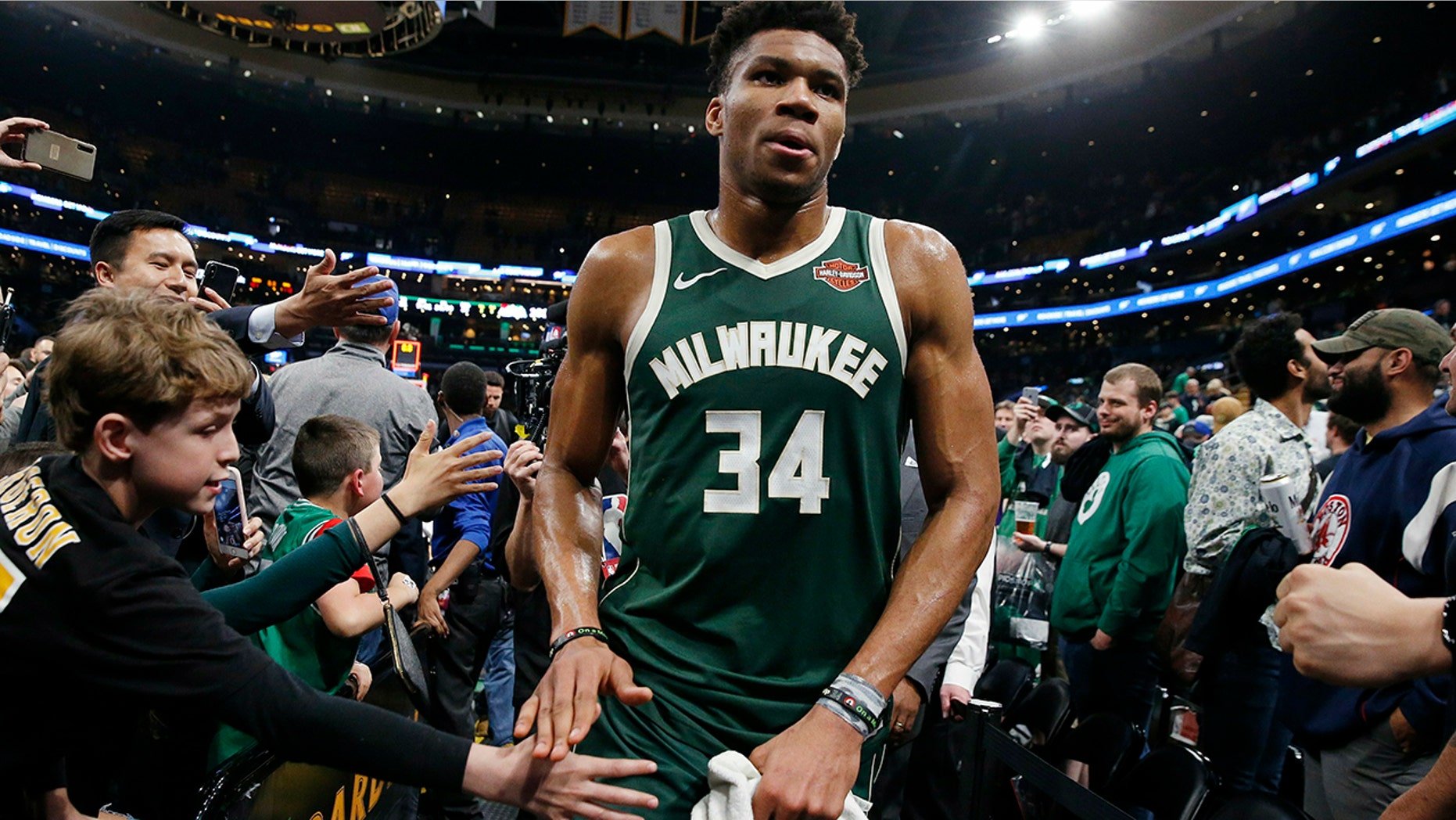 Milwaukee Bucks' Giannis Antetokounmpo leaves the court after defeating the Boston Celtics in Game 4 of a second-round NBA basketball playoff series in Boston, Monday, May 6, 2019. (AP Photo/Michael Dwyer)
