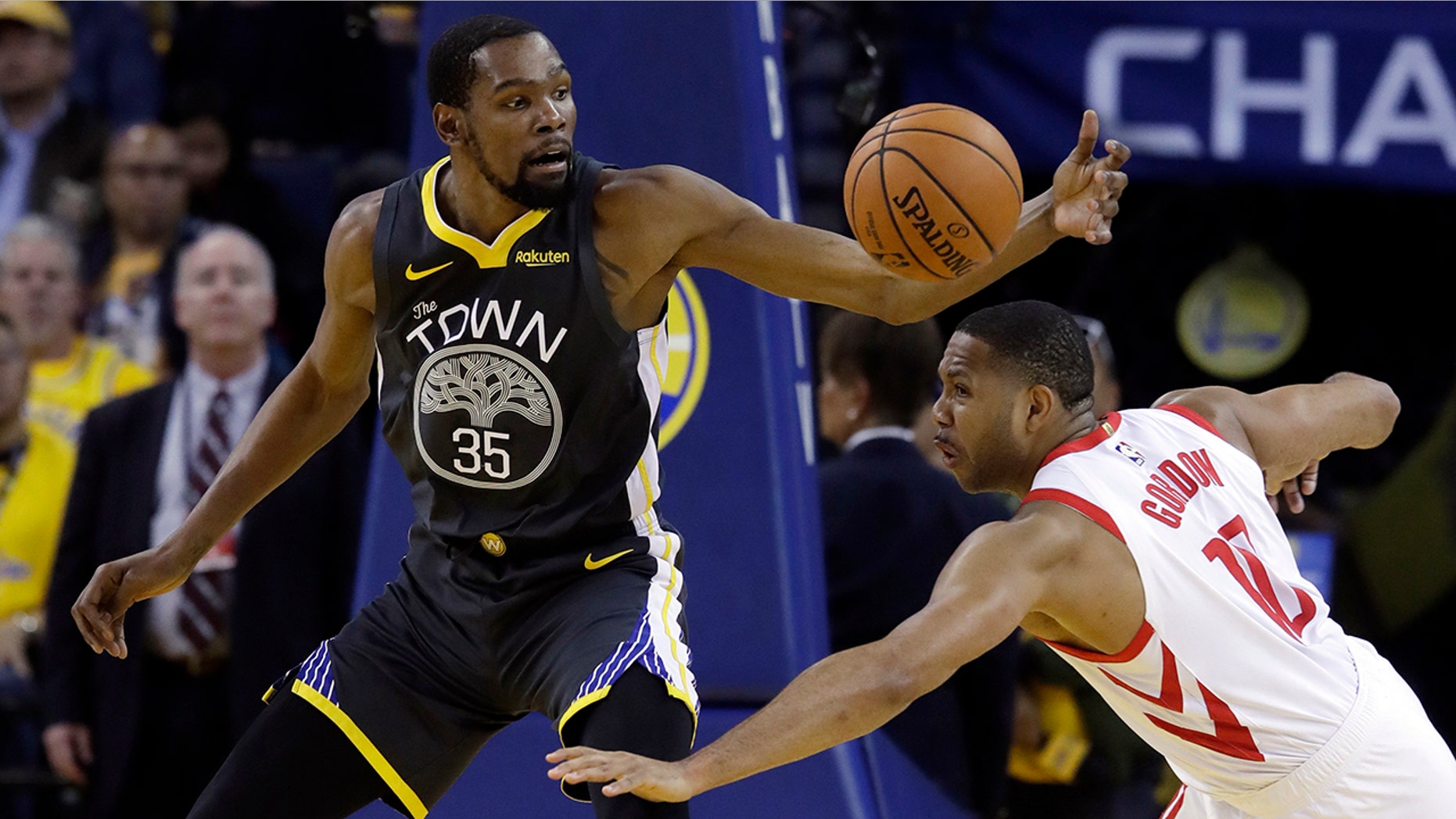Golden State Warriors' Kevin Durant (35) is defended by Houston Rockets' Eric Gordon during the first half of Game 2 of a second-round NBA basketball playoff series in Oakland, Calif., Tuesday, April 30, 2019. (AP Photo/Jeff Chiu)